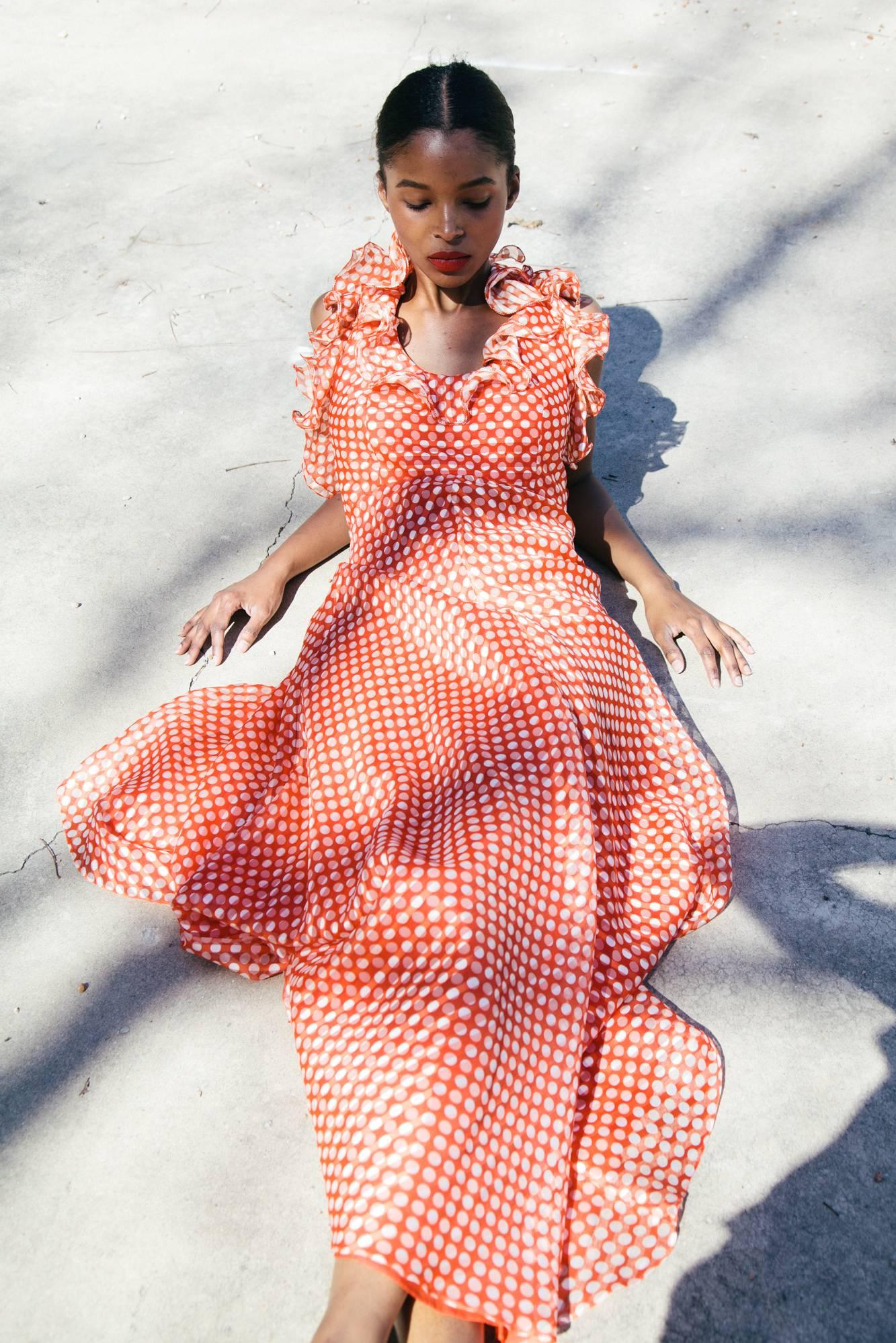 1970s Geoffrey Beene red and white polka dot silk halter gown.  Ruffles at neck.  Condition: Very good.  Size 6 - 8 

We accept returns for refund, please see our terms.  We offer free ground shipping within the US.  Let us know if you have any