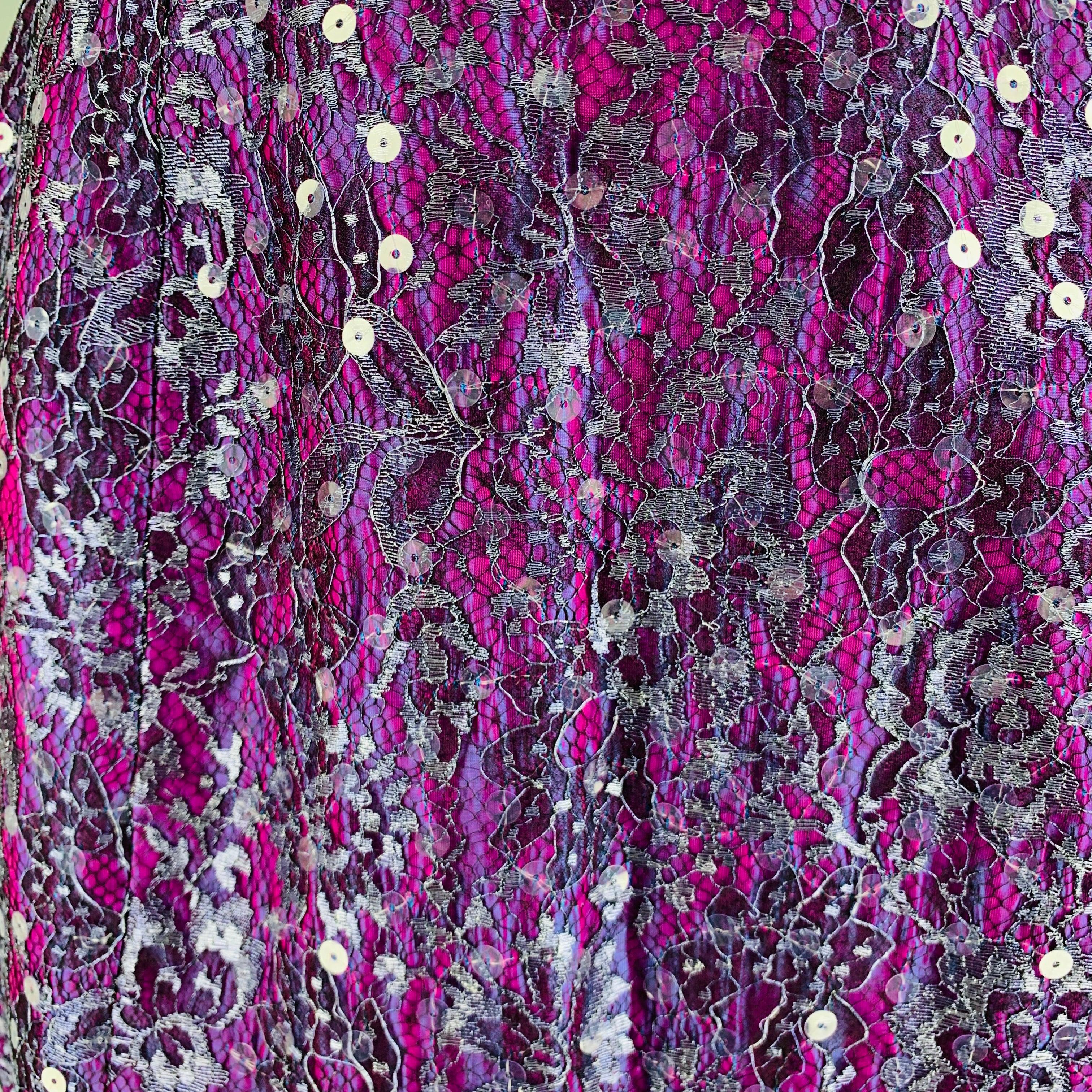 GEOFFREY BEENE skirt comes in a purple and silver lace material featuring a pencil style, and a zip up closure. Very Good Pre-Owned Condition. 

Marked:   6 

Measurements: 
  Waist: 27 inches Hip: 35 inches Length: 21.5 inches  
  
  
 
Reference