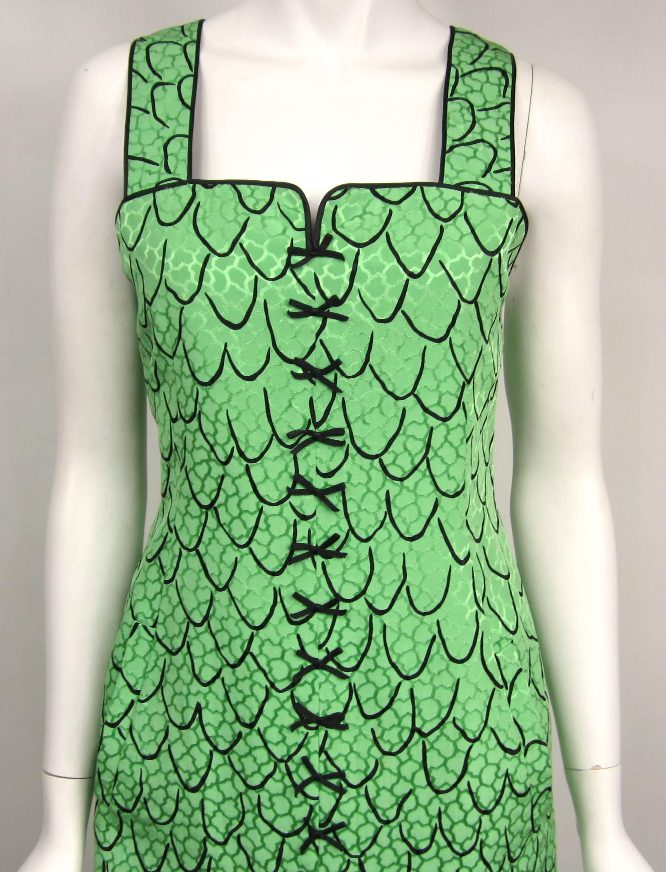 Stunning Green Geoffrey Beene Trompe L'oeil dress. Tags still attached, never worn. Size 4. Measurements are Up to 34-inch chest --- Up to 30-inch waist --- Up to 37-inch hips --- Length 41 inches. This is out of a massive collection of New Old