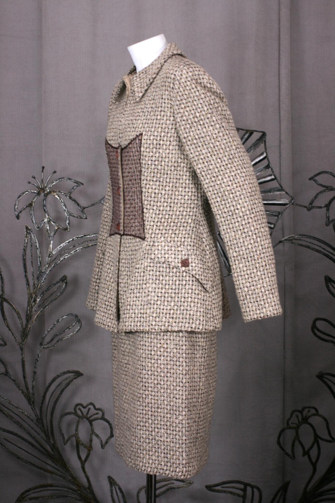 Geoffrey Beene Tweed and Tulle Overlaid Suit from the 1990's. Typical easy Beene cut with a textured tweed with a tulle overlay down front quilted in metallic thread. 
Size 8. 1990's USA. 