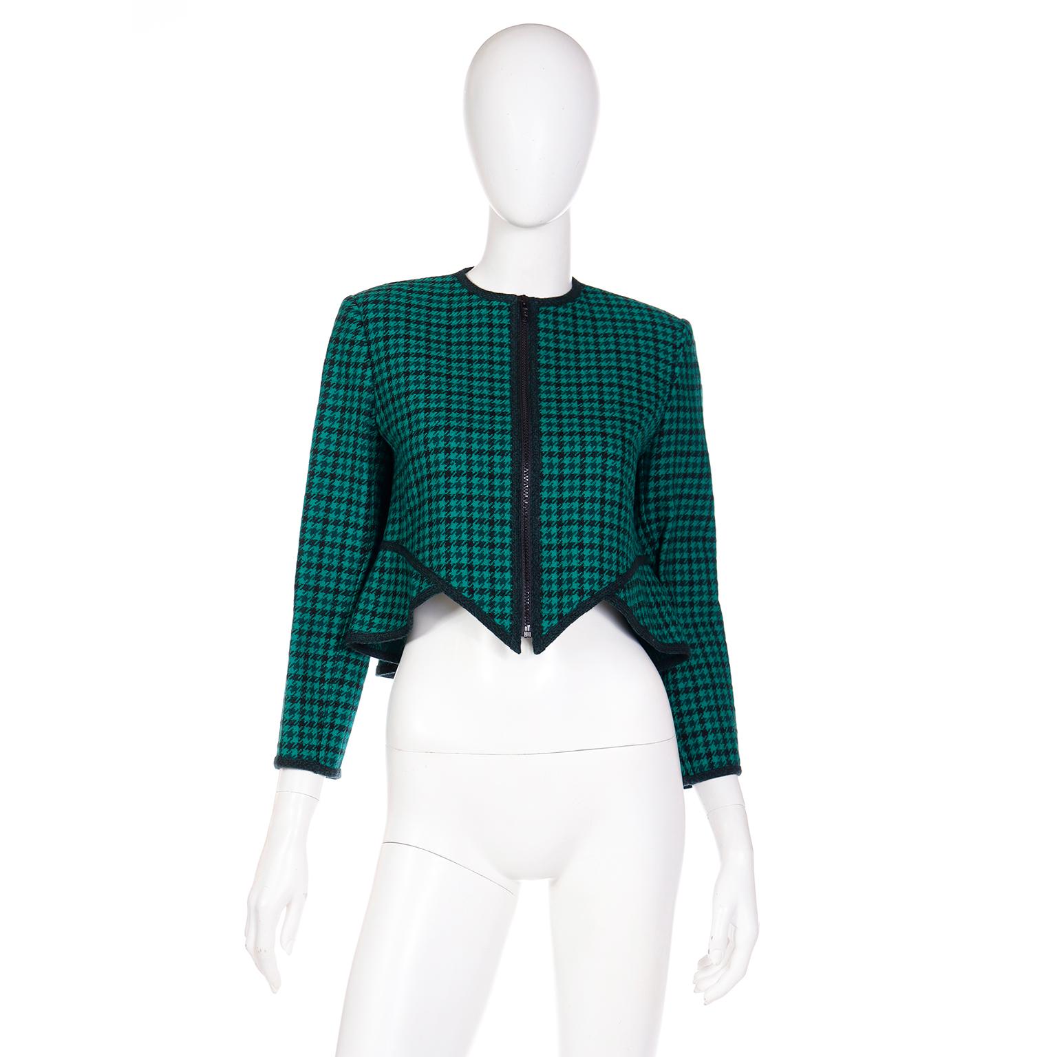 This vintage Geoffrey Beene jacket is in an iconic signature Beene silhouette. From the uniquely angled hem to the bold dark green trim, this piece is unmistakably a jacket designed by Mr. Beene. We love the cut of this jacket and it can be worn