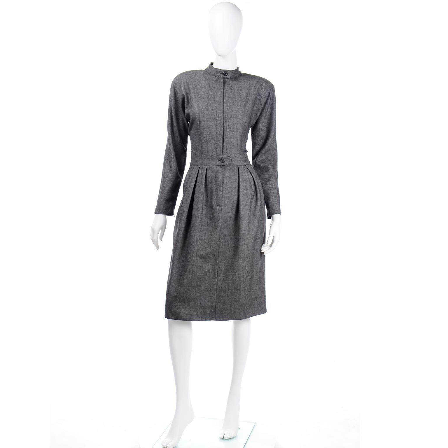 We love vintage Geoffrey Beene pieces and this dress is a classic piece that has the quality you would expect from Mr. Beene. The dress is in a woven micro check wool and has a single button at the mandarin style collar and a front center seam
