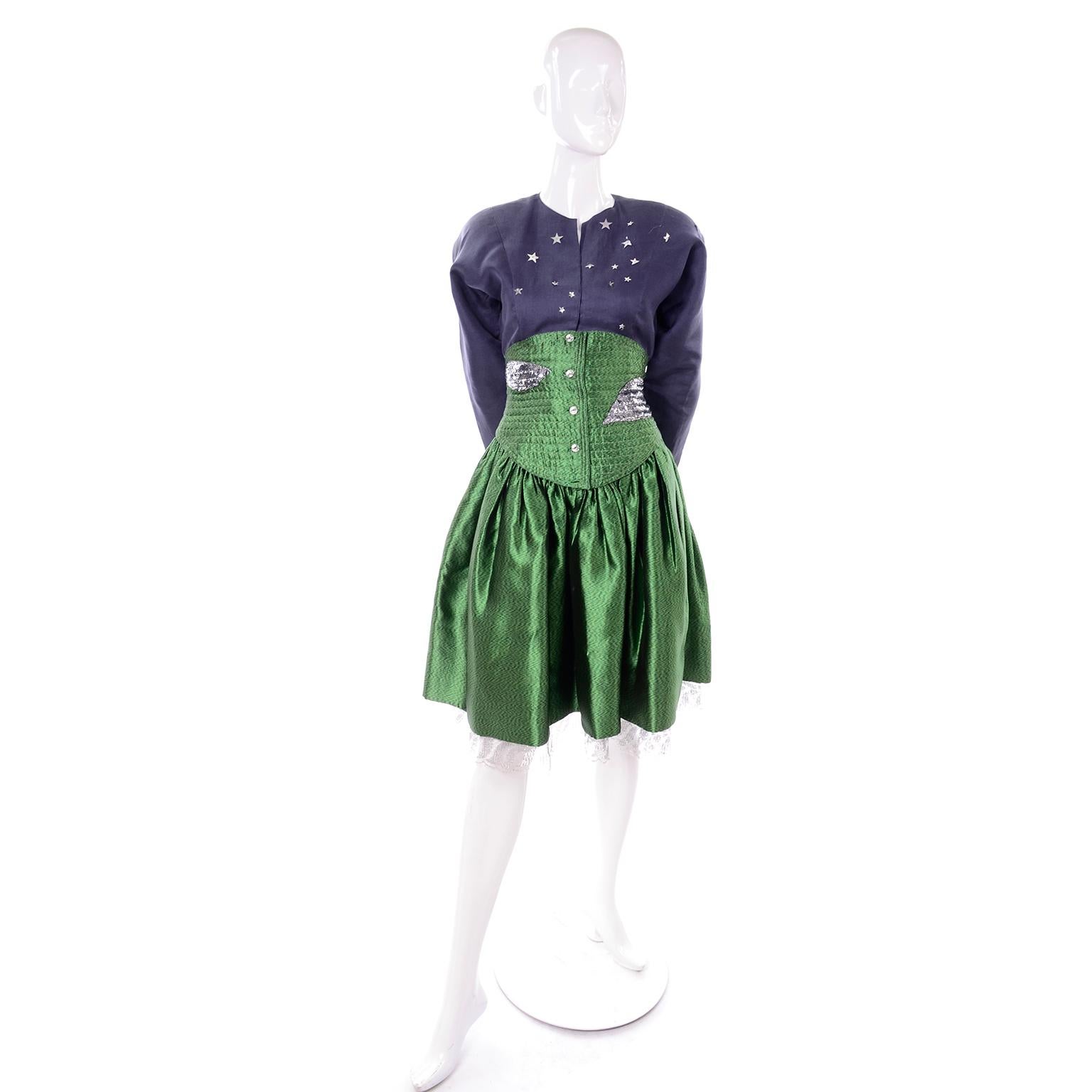 This is an outstanding vintage two piece dress from Geoffrey Beene! The top is a dark dusty blue organza and it is covered with little silver stars. The skirt is a lush green taffeta and has a quilted corset style waist with metallic silver shapes