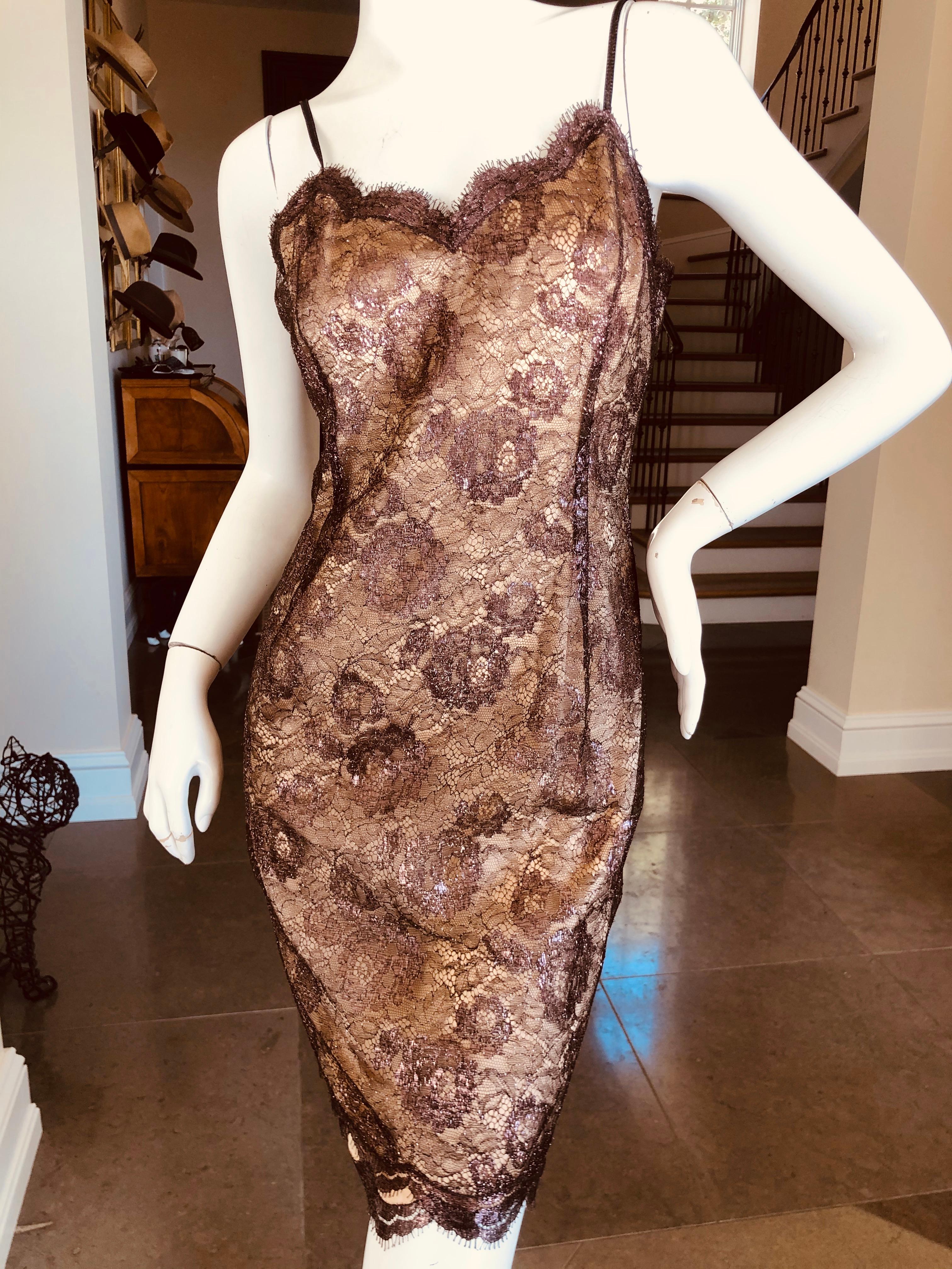 Geoffrey Beene Vintage Metallic Accented Lace Dress with Scallop Edges.
There are two layers, the sheer metallic lace, and a nude under dress . Both layers have a scalloped hemline, a Beene signature.
Wide leather belt was shown with this dress, I