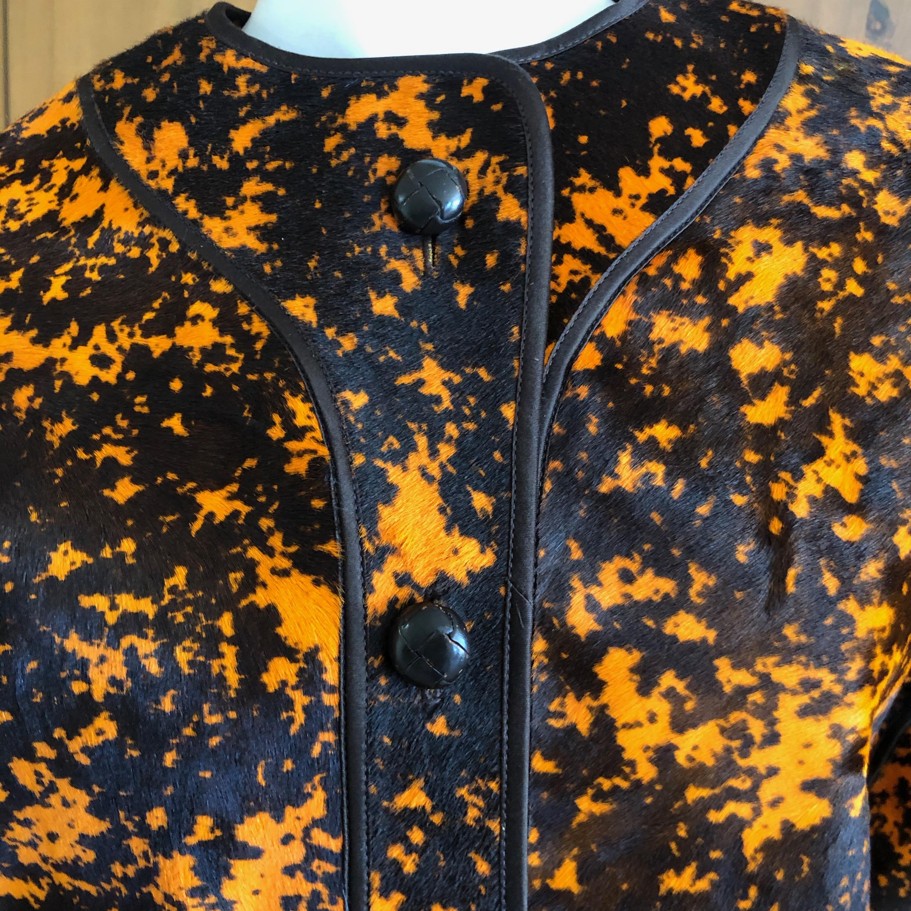 Geoffrey Beene Vintage Orange Splatter Print Ponyhair Jacket.
Classic Beene styling, this is stunning.
It is calf hair with quilted lining, so be advised it is quite heavy , and a little stiff due to the nature of the hides.
Bust 40