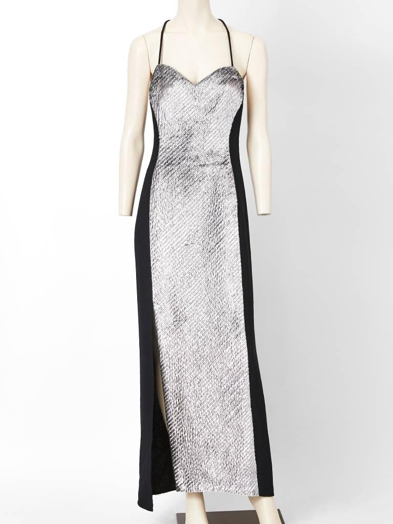 Geoffrey Beene textured wool crepe and silver panné velvet evening gown and matching bolero jacket. Gown is a bias cut slip style having a sweetheart neckline 
thin spaghetti straps that criss cross at the open back. The center front panel of the