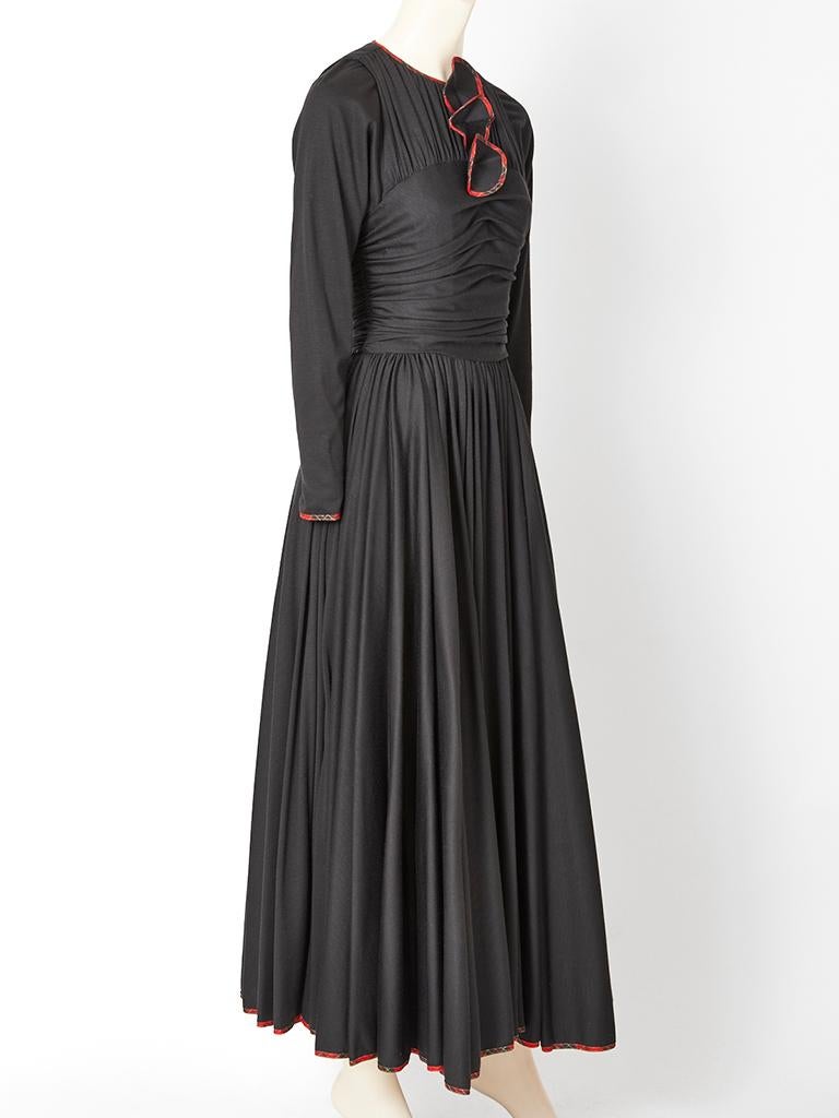 Geoffrey Beene, wool jersey, princess line, long sleeve, maxi dress, having a full skirt,  jewel neckline and a ruched bodice.  Dress has an attached 