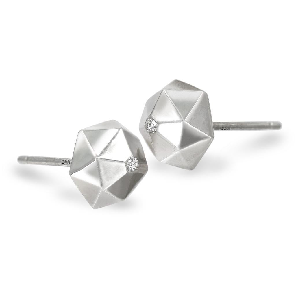 Hedra Diamond Stud Earrings by renowned jewelry maker Geoffrey Good featuring super high-polished sterling silver large hedra stud elements embedded with shimmering round brilliant-cut white diamonds. 

About the Maker - Geoffrey Good discovered his
