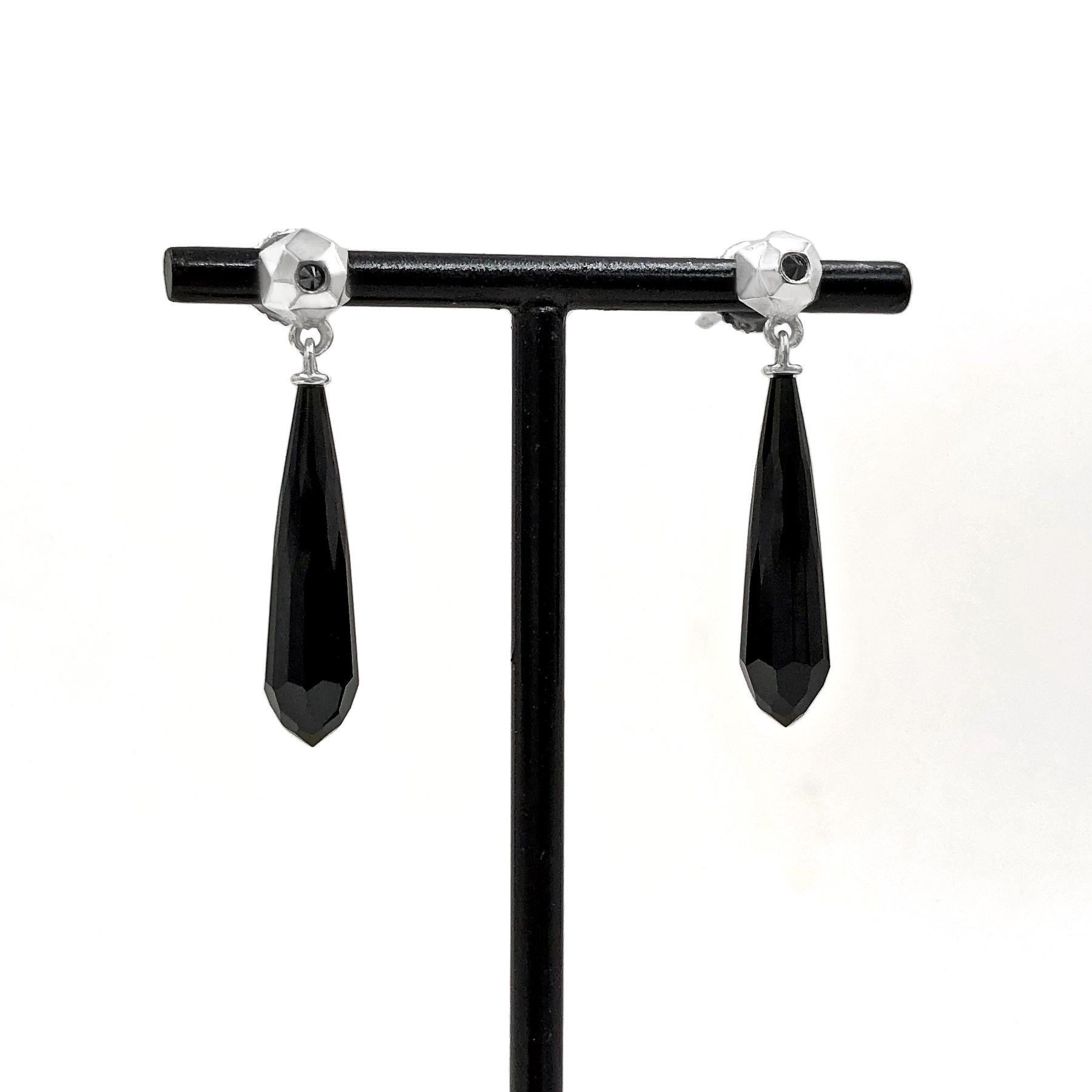 One-of-a-Kind Hedra Drop Earrings by renowned jewelry maker Geoffrey Good featuring a beautiful pair of natural, untreated Wyoming black jade faceted briolettes swinging from handmade, high-polished sterling silver hedra stud elements embedded with