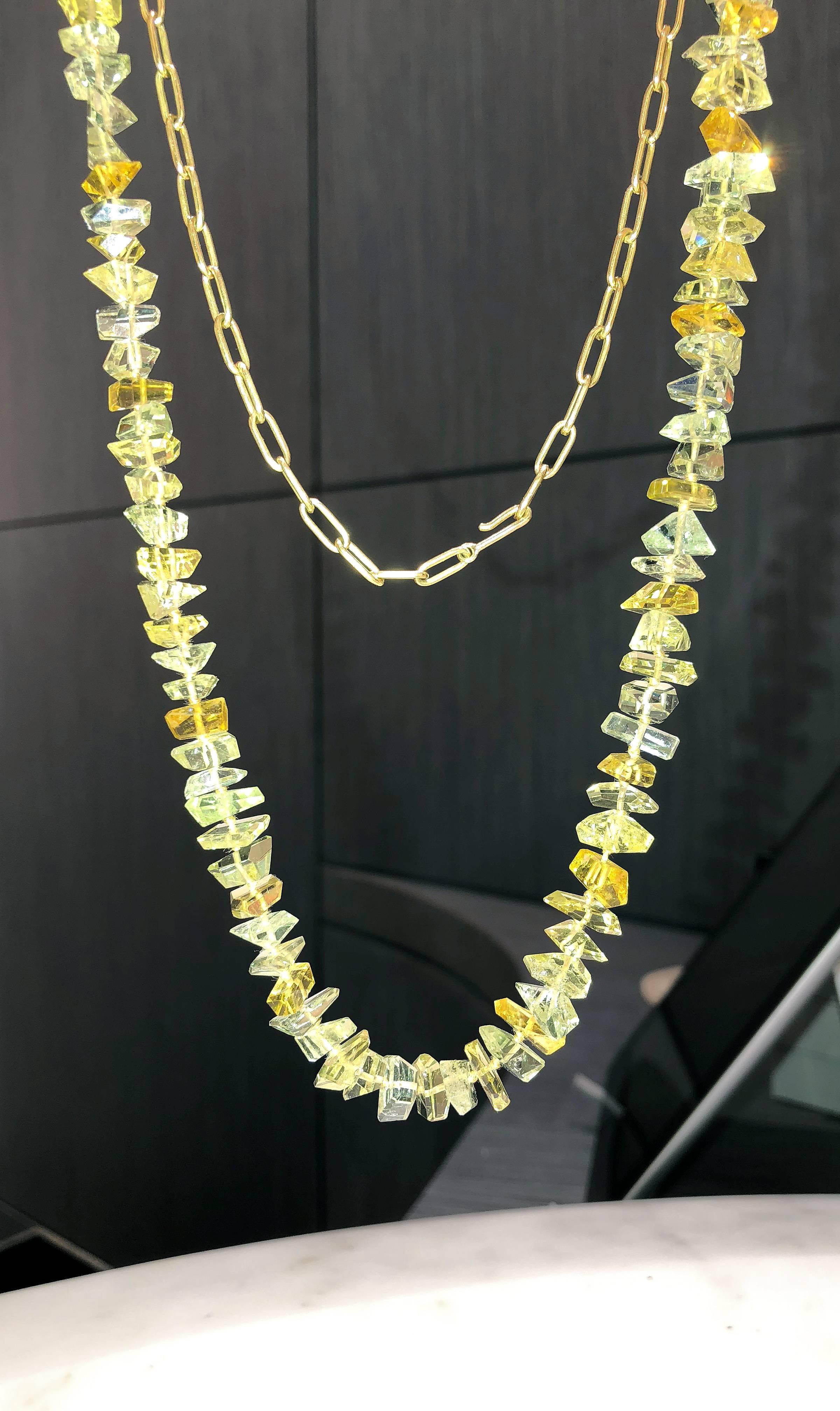 One of a Kind Free Facets Long Necklace handcrafted by renowned jewelry artist Geoffrey Good showcasing a spectacular array of exceptionally faceted and polished heliodor beryl gemstones strung on silk cord and attached to a handmade matte-finished