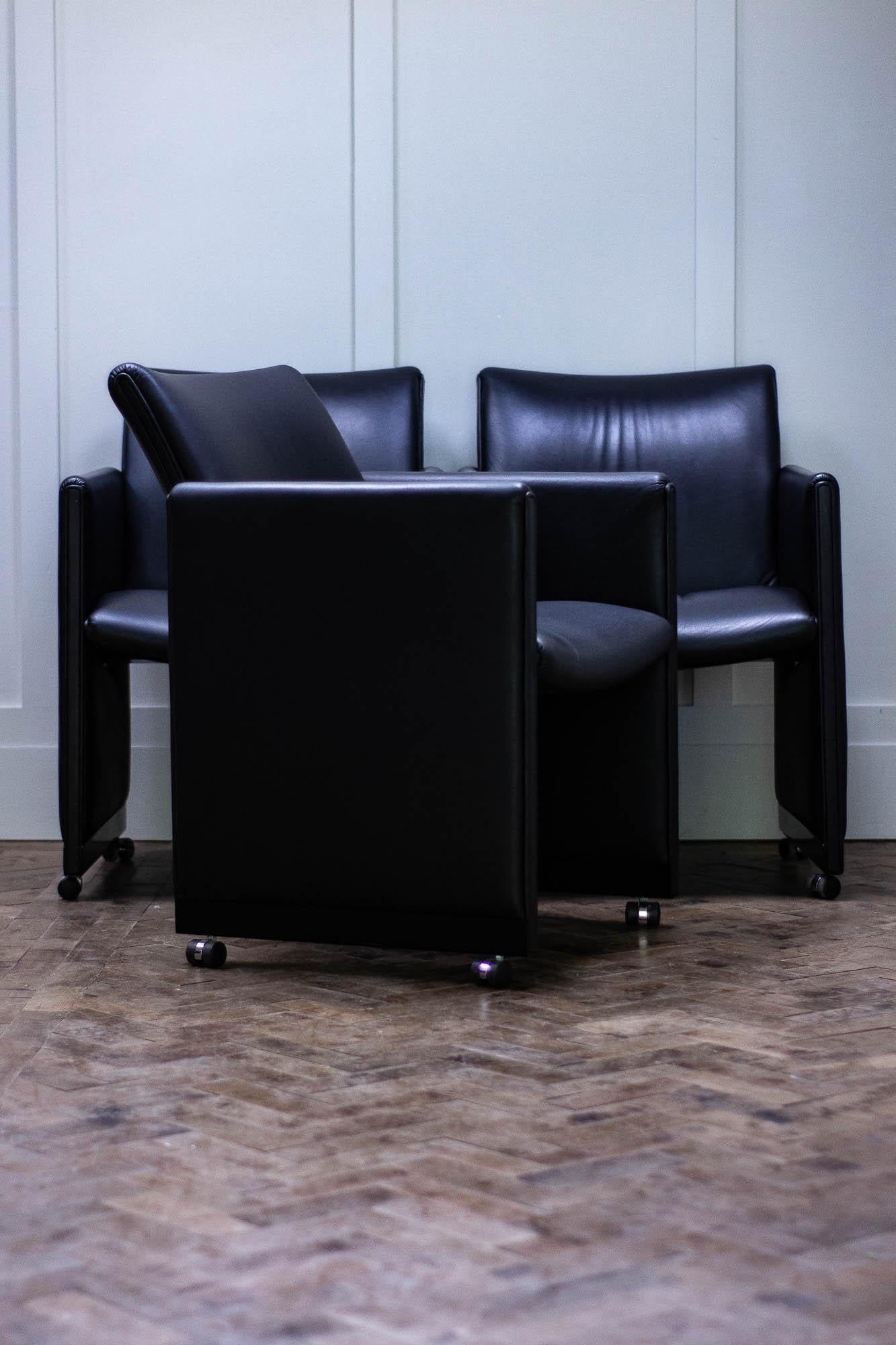 Three black leather chairs available by Geoffrey Harcourt for Dutch manufacturer Artifort.

The chairs are on casters and date from the 1980s. 

One chair has some small damage, which is shown in the images. 

Height 85cm
Seat Height 48cm
Width