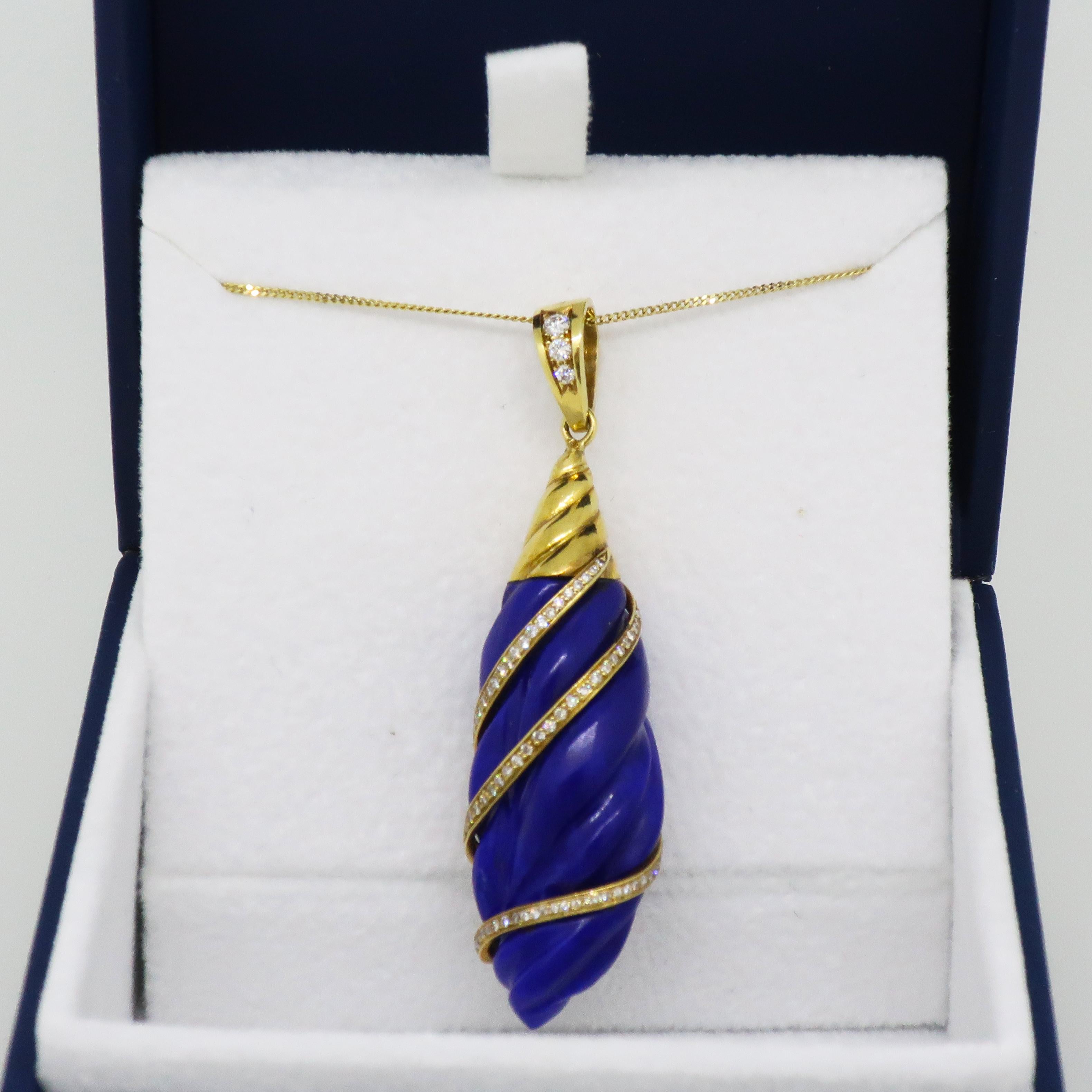 Geoffrey Rowlandson Lapis Lazuli & Diamond Pendant Yellow Gold

Gorgeous and stand out lapis lazuli and diamond Pendant. Free form lapis lazuli in a gorgeous deep blue colour, encased with a swirl of small white brilliant cut diamonds wrapping round