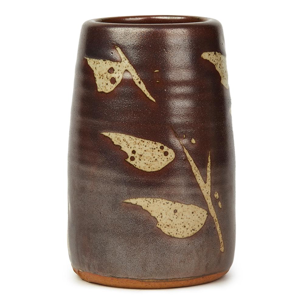 A very stylish and good sized studio pottery stoneware vase decorated in tenmoku glazes on a grey glazed ground with wax resist leafy twig like designs repeated around the body by renowned and highly sought after potter Geoffrey Whiting (1919-1988).