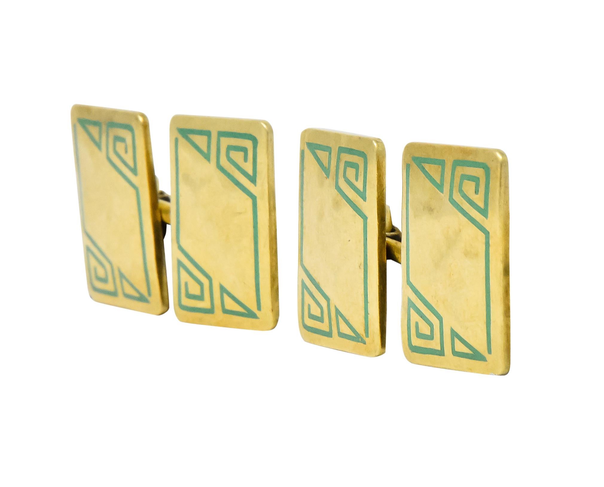 Link style cufflinks, each ending with a hammered gold rectangle measuring approximately 11.4 x 15.8 mm

Surrounded by green enamel boarder depicting a stylized Greek key and triangle

Each initialed 'J.M.' on back

Circa 1930

Maker's mark for
