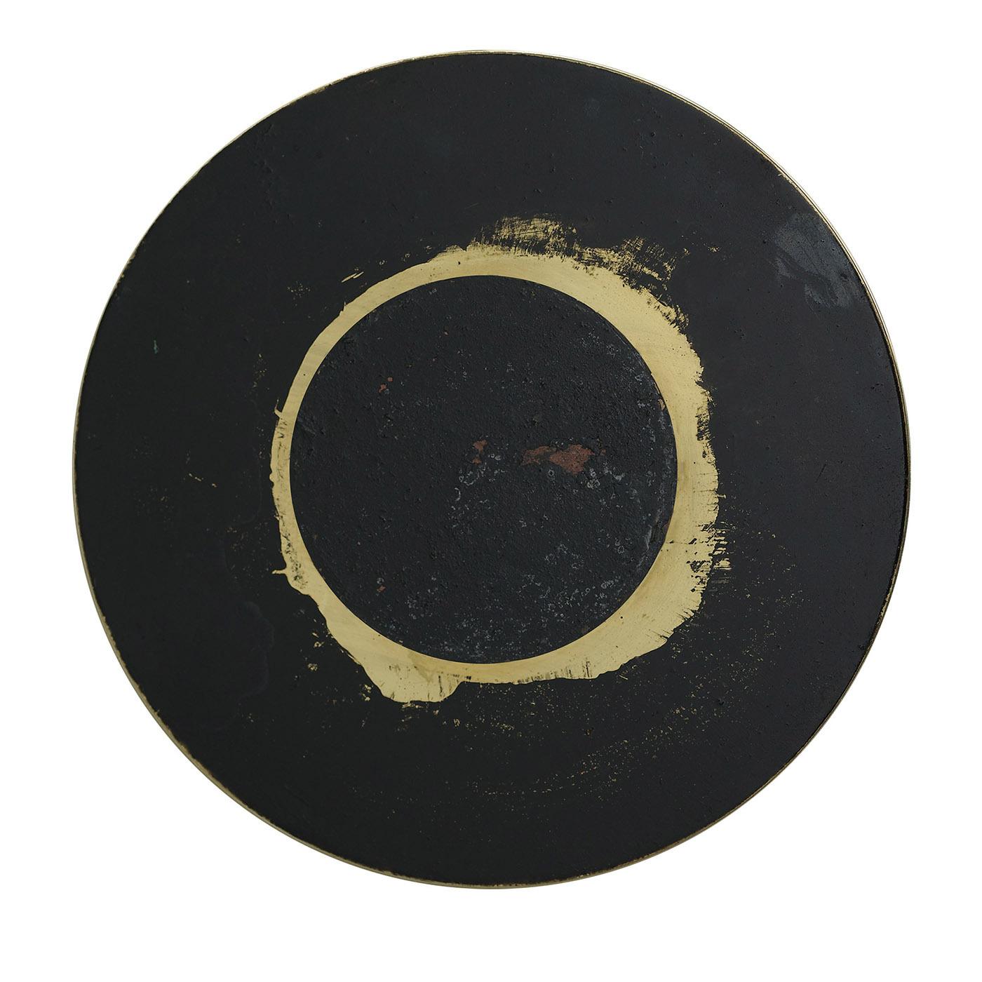 This one-of-a-kind decorative disk celebrates the unpredictable, abstract traceries revealed by oxides applied to a glistening brass backdrop. Deftly crafted by hand and signed at the back, it brims with artistic character and comes equipped with a