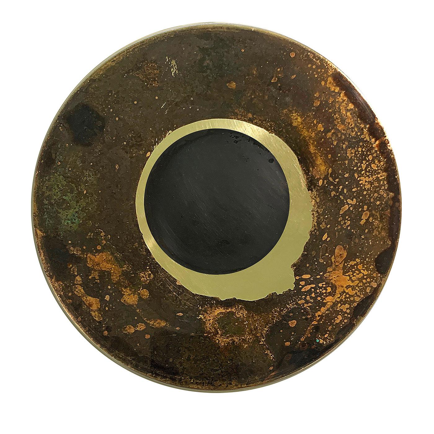 Daring experimentation with acids and oxides on a brass backdrop led to this stylish decorative disk part of the Geografie Emozionali Collection. Golden, green, and dark hues define the traceries sketched out by the chemical reactions applied to the
