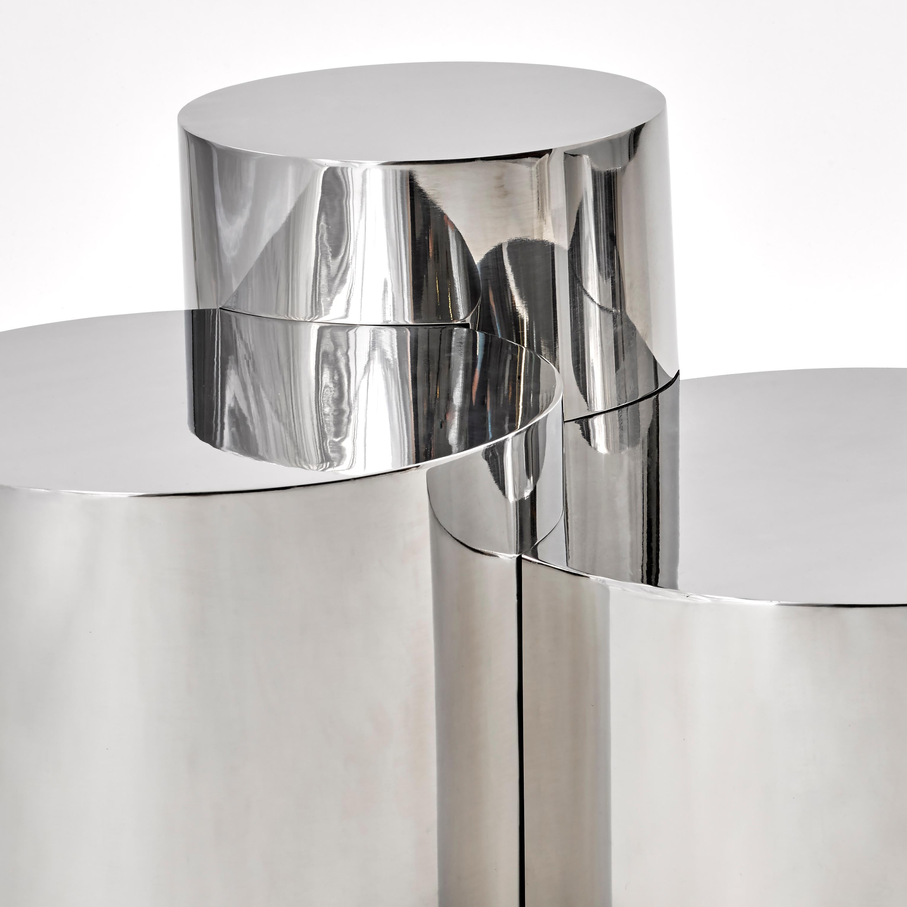 The Geometria: Cerchi #4 table by form A elevates the Minimalist form of the cylinder by joining and overlapping them to create a highly sculptural piece. Shown in polished steel with three cylinders.

Customization Options: 

Each piece is