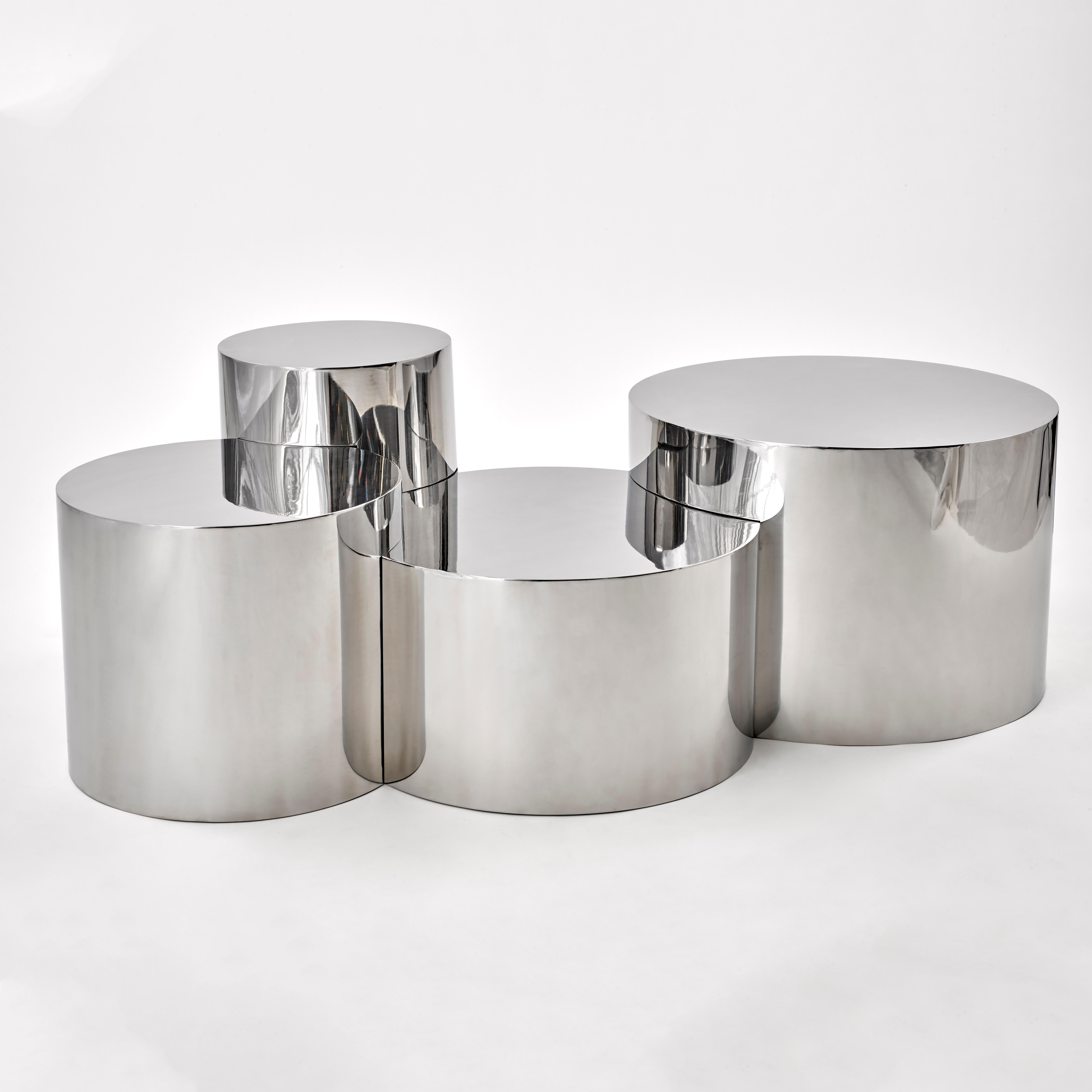 The Geometria: Cerchi #4 table elevates the minimalist form of the cylinder by joining and overlapping them to create a highly sculptural piece. Shown in polished steel with four cylinders.

Customization Options: 

Each piece is hand crafted in