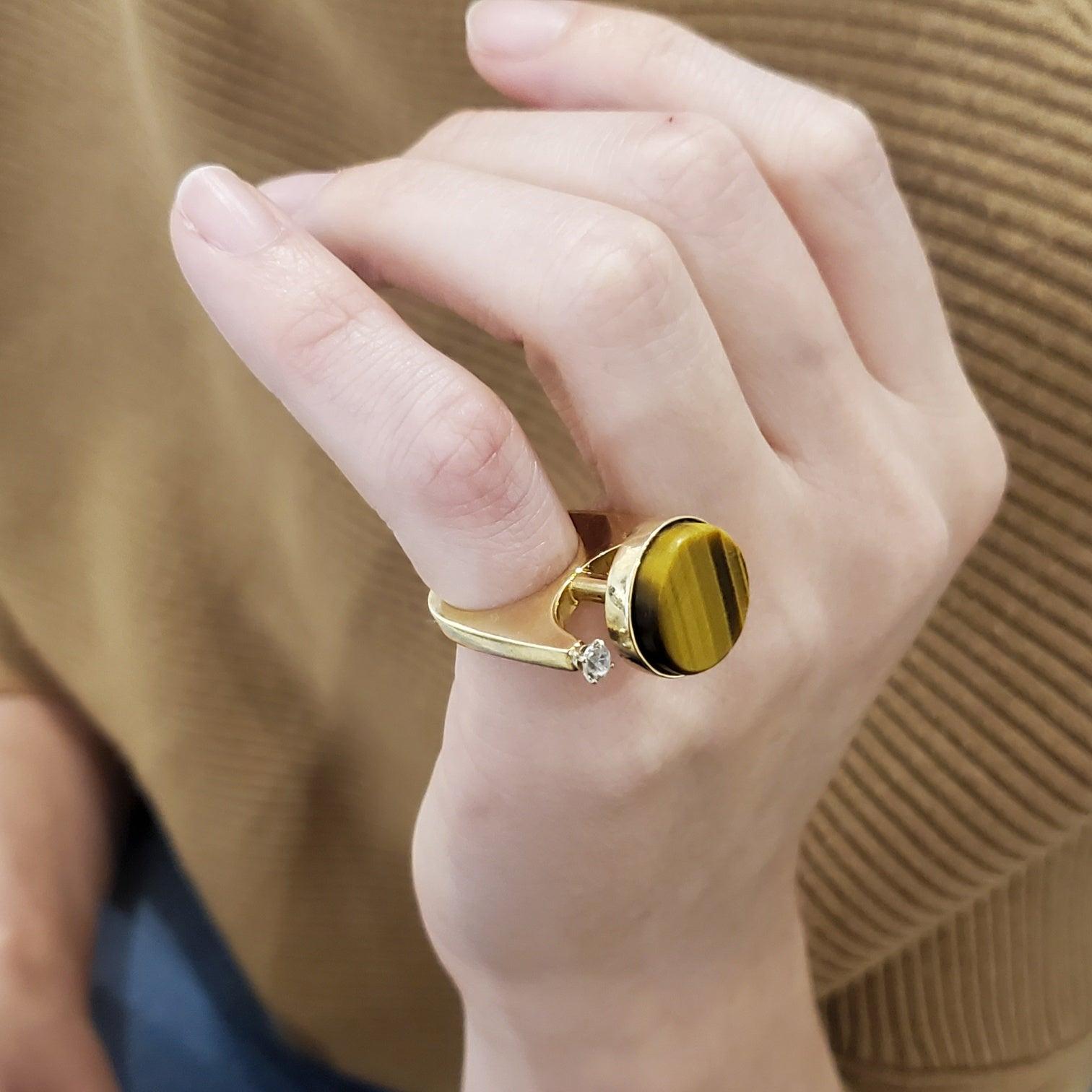 Sculptural retro ring from the modernism period.

Beautiful three dimensional sculptural ring, created during the modernist period, back in the 1970. This gorgeous geometric cocktail ring has been crafted with unusual shapes in solid yellow gold of