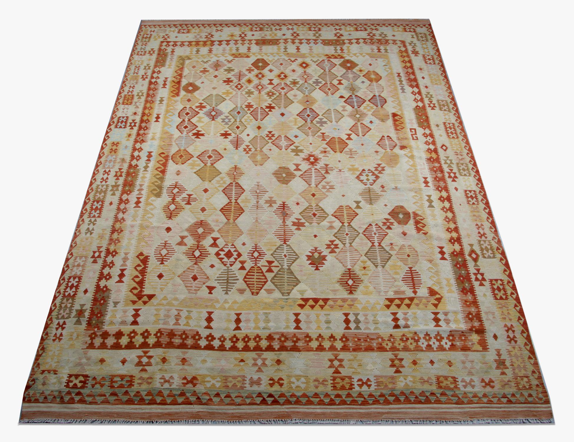 This geometric Kilim rug was handmade in Afghanistan by Uzbek and Turkman tribes. The rug is of the highest quality thanks to the fine hand-spun wool and cotton. Dyed using, only organic vegetable dyes. The designs belong to the Qashqai tribes. The