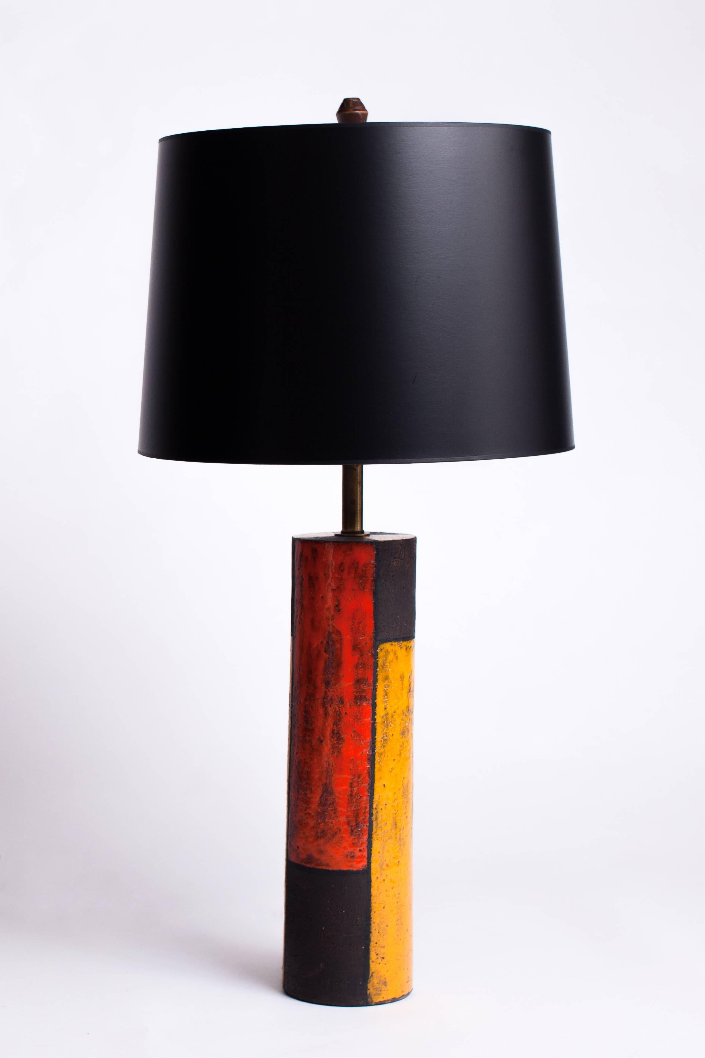Aldo Londi (1911–2003).

Striking ceramic “Mondrian” table lamp by Aldo Londi for historic Italian ceramics house Bitossi. With brass mounts and a vibrant red and yellow glaze on matte black field in a cubist, geometric design. For fifty years