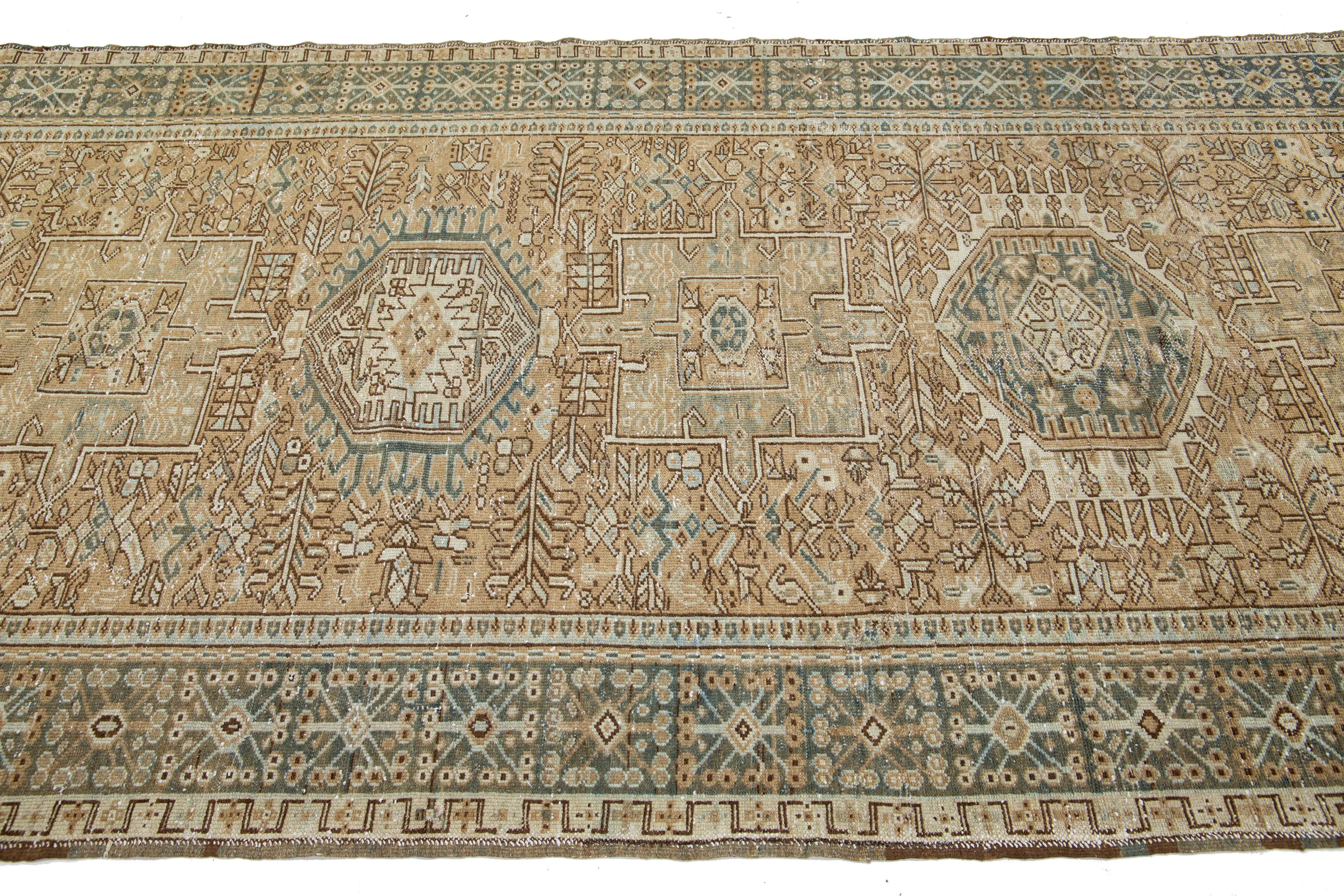 Persian Geometric Antique Heriz Handmade Wool Runner featuring a Brown Field For Sale
