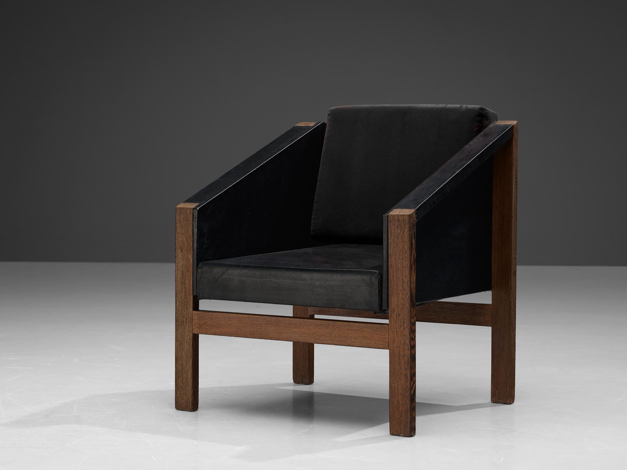 Armchair, wengé, black leatherette, Europe, 1960s. 

Eccentric armchair with quirky geometric lines. Its design strongly resembles the distinguished designs of Dutch designer Wim den Boon. Note for example the sharp lines of the armrests that