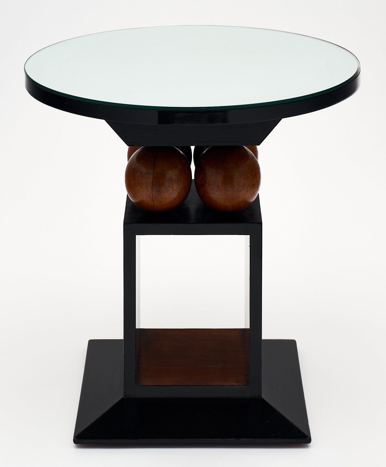 French Art Deco geometric gueridon featuring “cubist” elements. We loved the perfect balance and the beautiful walnut grain contrasting with the deep luster of the ebony French polish. Mirrored top.