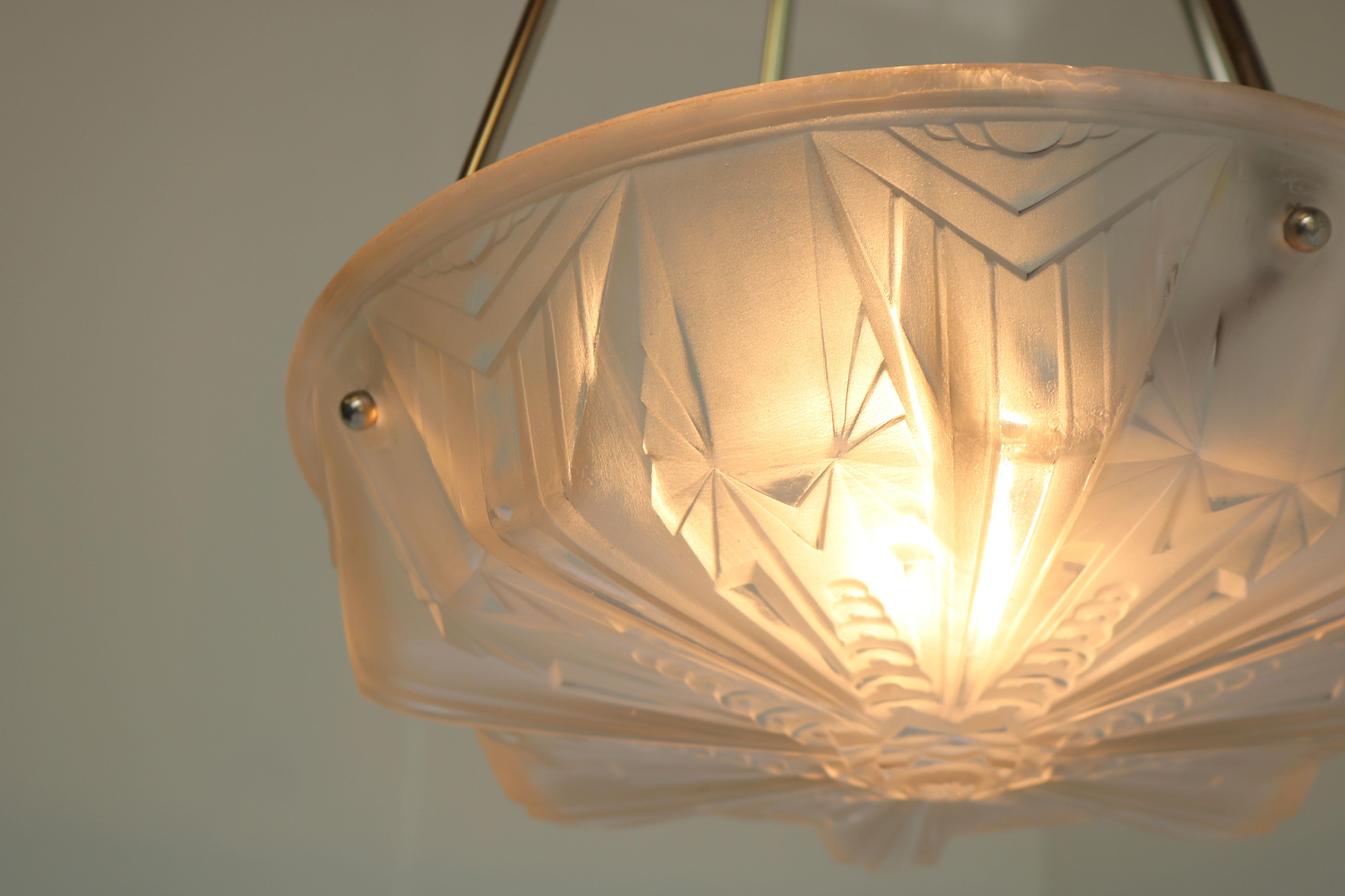 Gorgeous & timeless! This French Art Deco pendant by Muller Frères Luneville 1930. 
Marvelous white frosted glass shade with amazing geometric Art Deco motives. Rare Muller model. 
Exquisite frame in silver with floral Art Deco decorations.