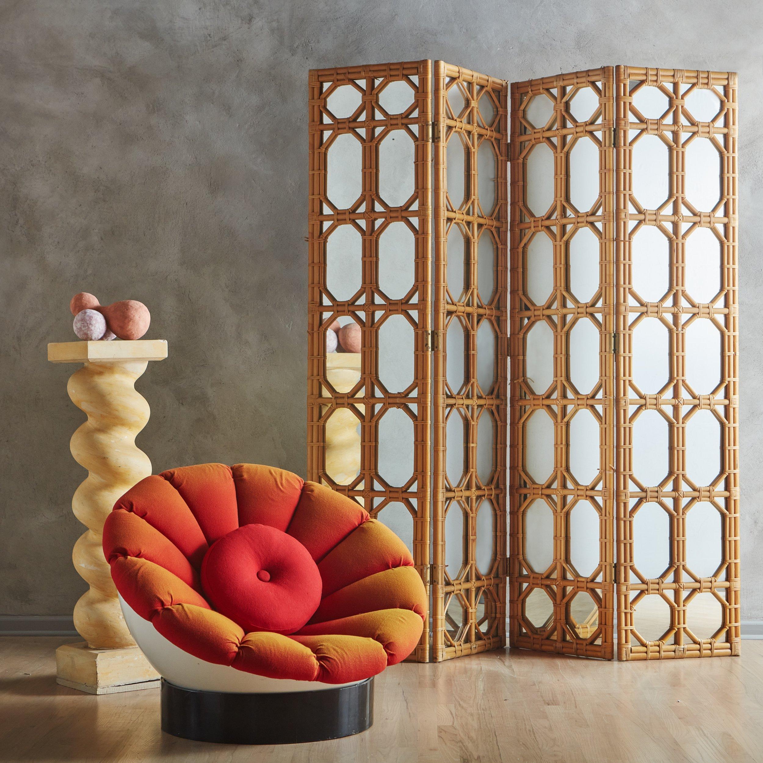 A beautiful vintage room divider or screen. This piece features four mirrored panels with a bamboo and cane frame in a geometric pattern. It has great scale and patinated brass hinges, which allow it to be adjusted. Unmarked. 20th Century.
 

