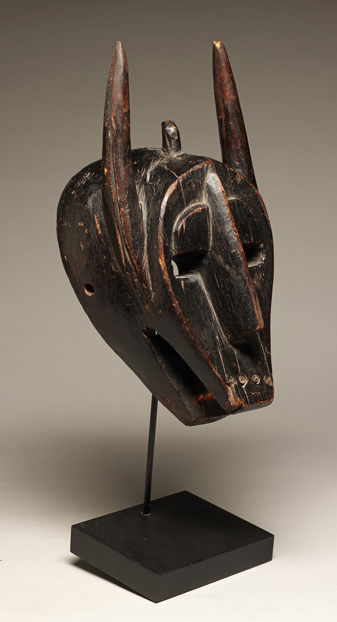 Hand-Carved Geometric Barmbara Sukuru Animal Mask with horns, teeth, Mali, West Africa For Sale