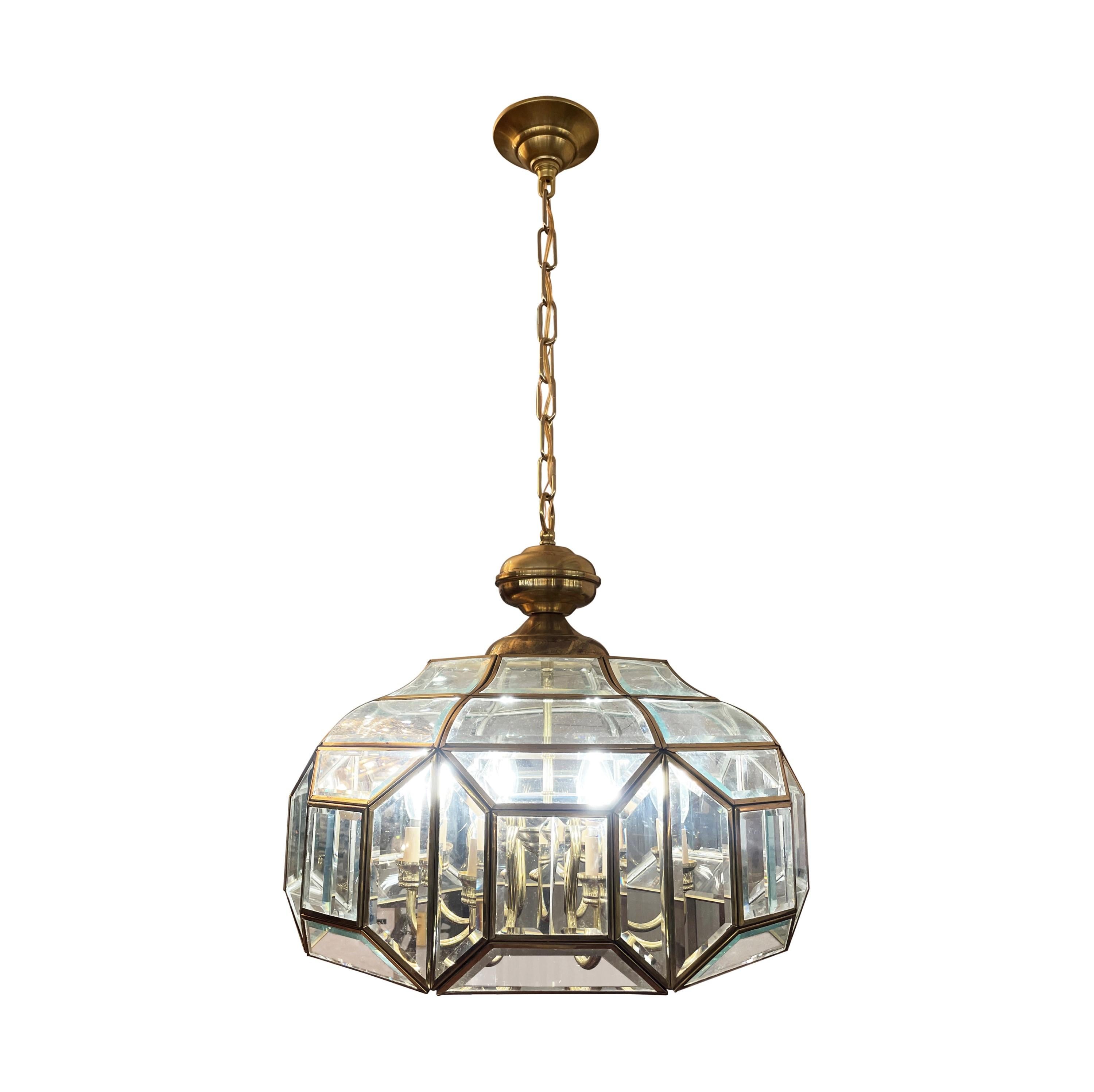 This Traditional beveled glass 8 light chandelier pendant light is a stunning centerpiece, combining classic design with sparkling beveled glass panels, intricate brass metalwork, and a warm, inviting glow, creating an enchanting ambiance. Cleaned