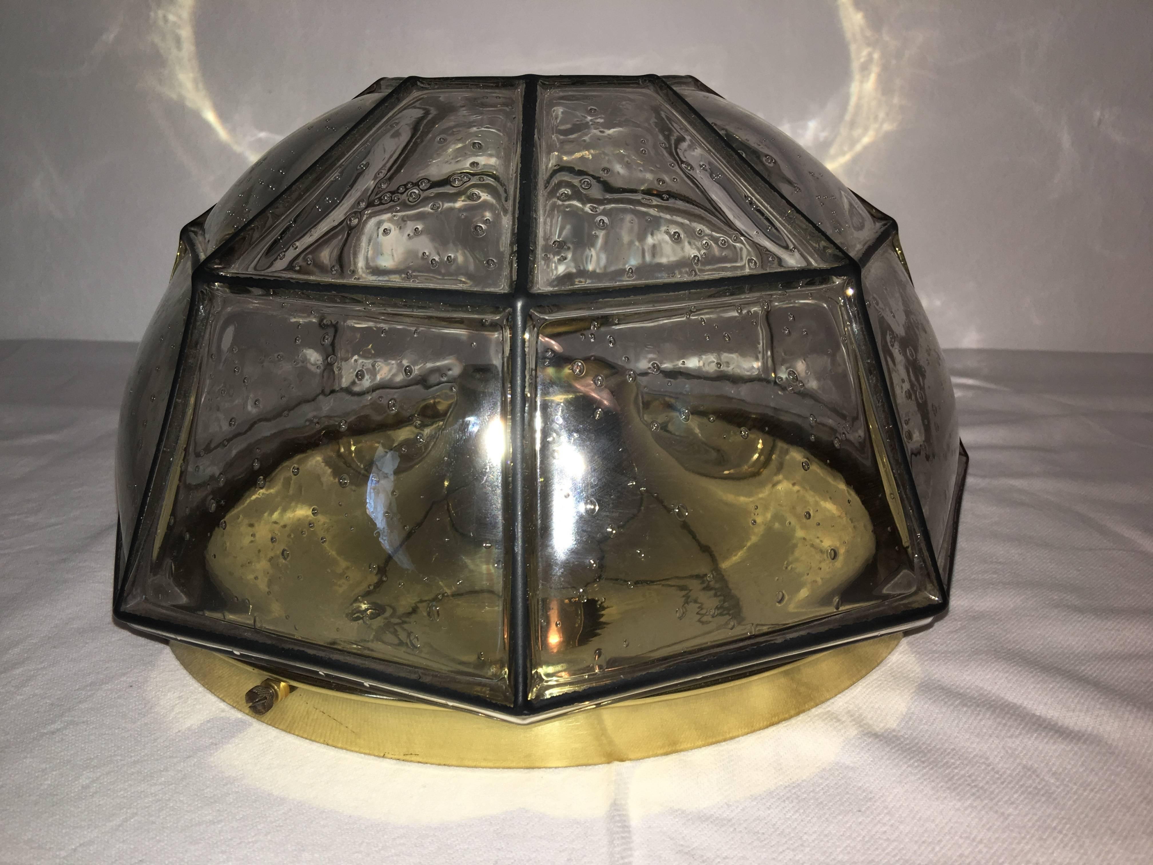 A beautiful clear air bubble glass flush mount with geometric black stripes by Limburg Leuchten Germany. The fixture requires one European E27 Edison bulb up to 75 watts.