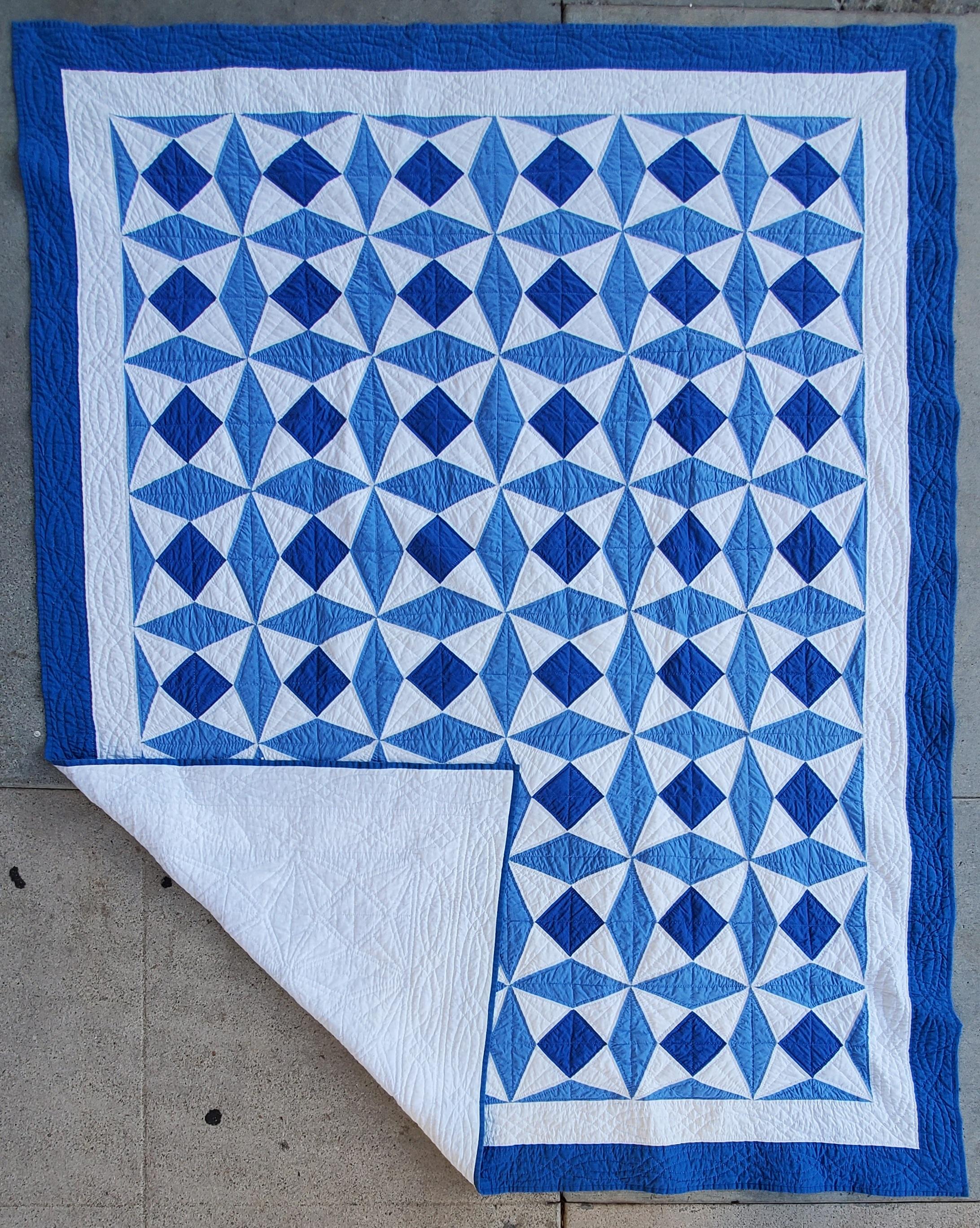 This unusual blue & white geometric quilt is in very good condition and nice piecework.