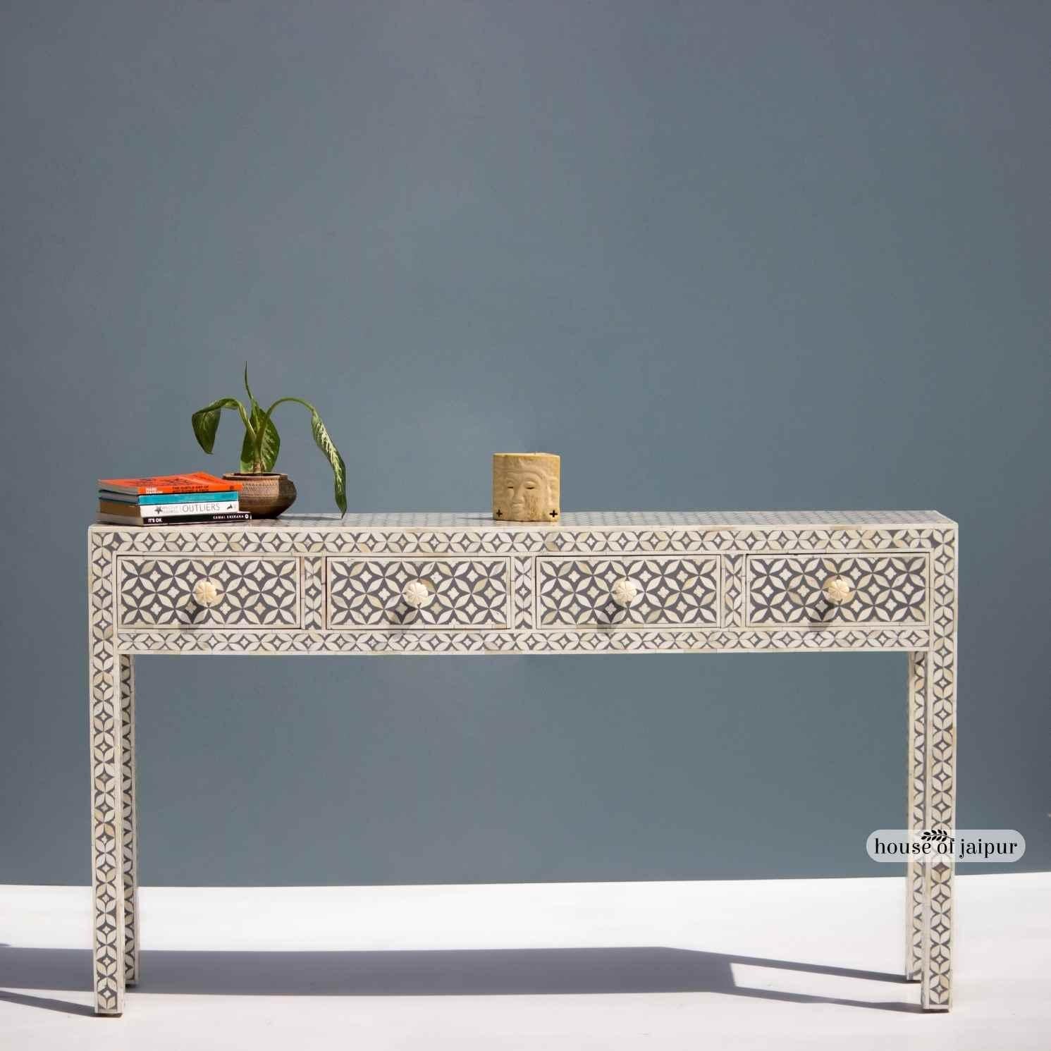 A refined blend of craftsmanship and contemporary design, this Bone Inlay Console Table features a striking geometric lattice pattern meticulously hand-laid across the entire structure. Each bone piece is individually cut and placed by skilled