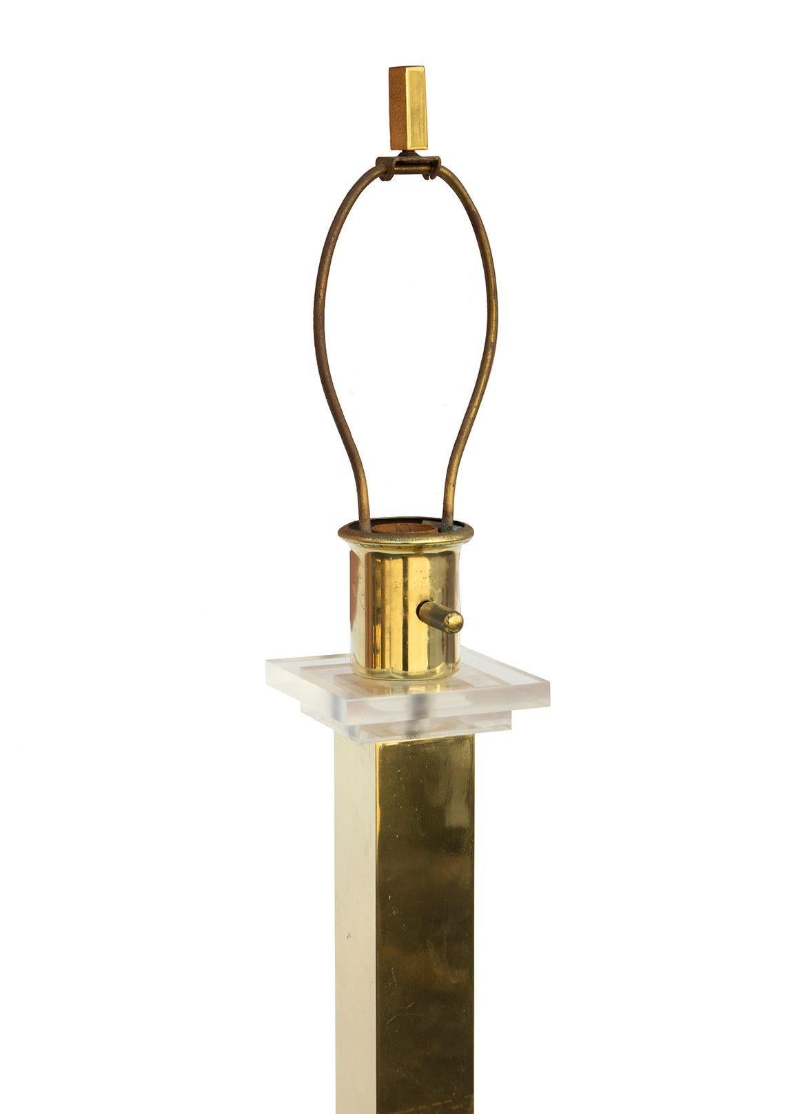 USA, 1980s
Geometric lucite and brass floor lamp. Weighted base, stacked square lucite details. No maker's marks. 
Condition notes: Some oxidation to the brass, slight marks to the finish. Original wiring is in working condition. 
Dimensions: