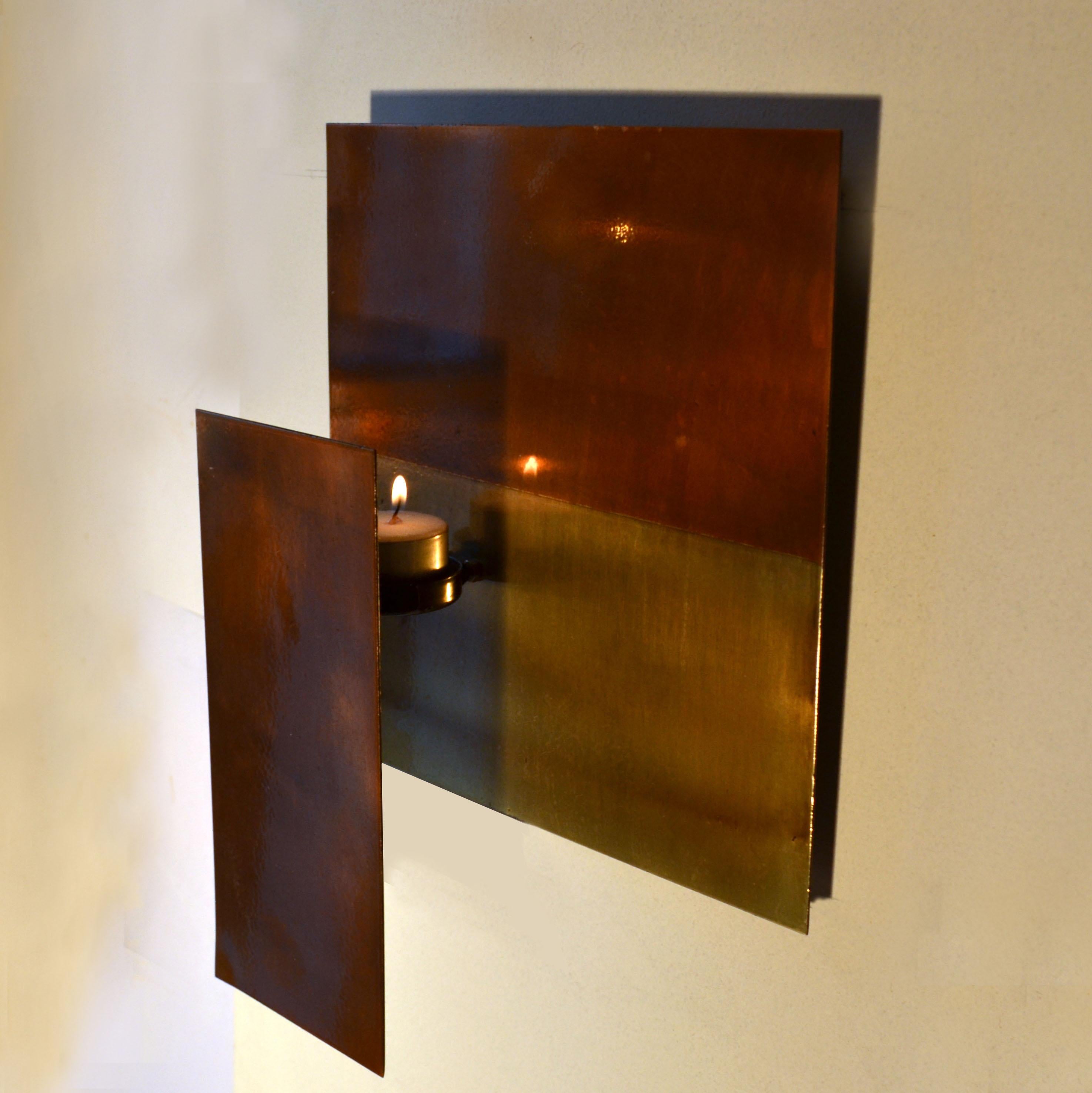 Three geometric minimal wall mounted sculptures that function as candle holders. The surface patina is part of the composition. They can be placed in any preferred order, easily mounted each on two hooks.
The candles used can be tea lights (which