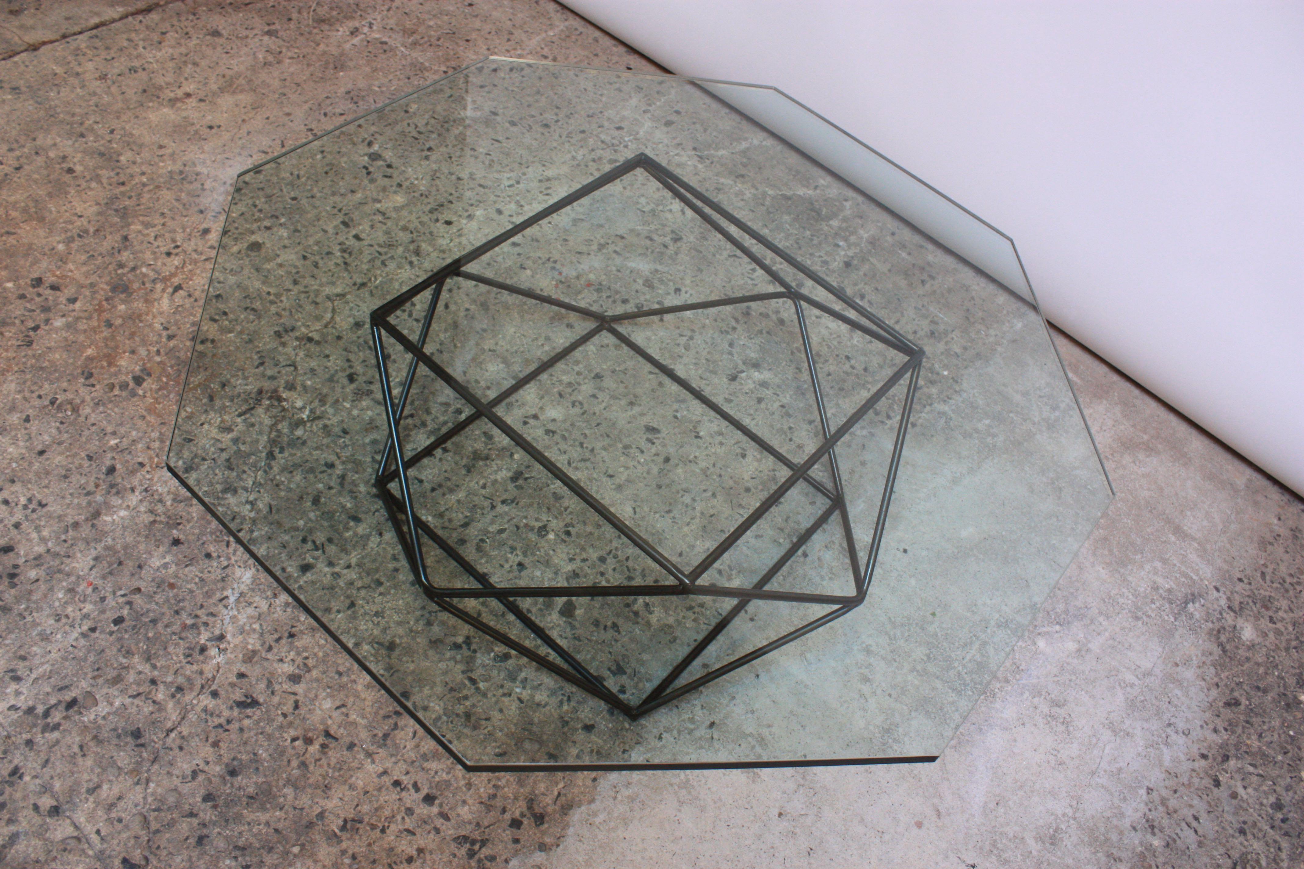 Early 1970s geometric coffee table by Milo Baughman for Directional. Bronze-finished base with original, octagonal glass top, rare in its complete presentation. Dense, glass is 3/4