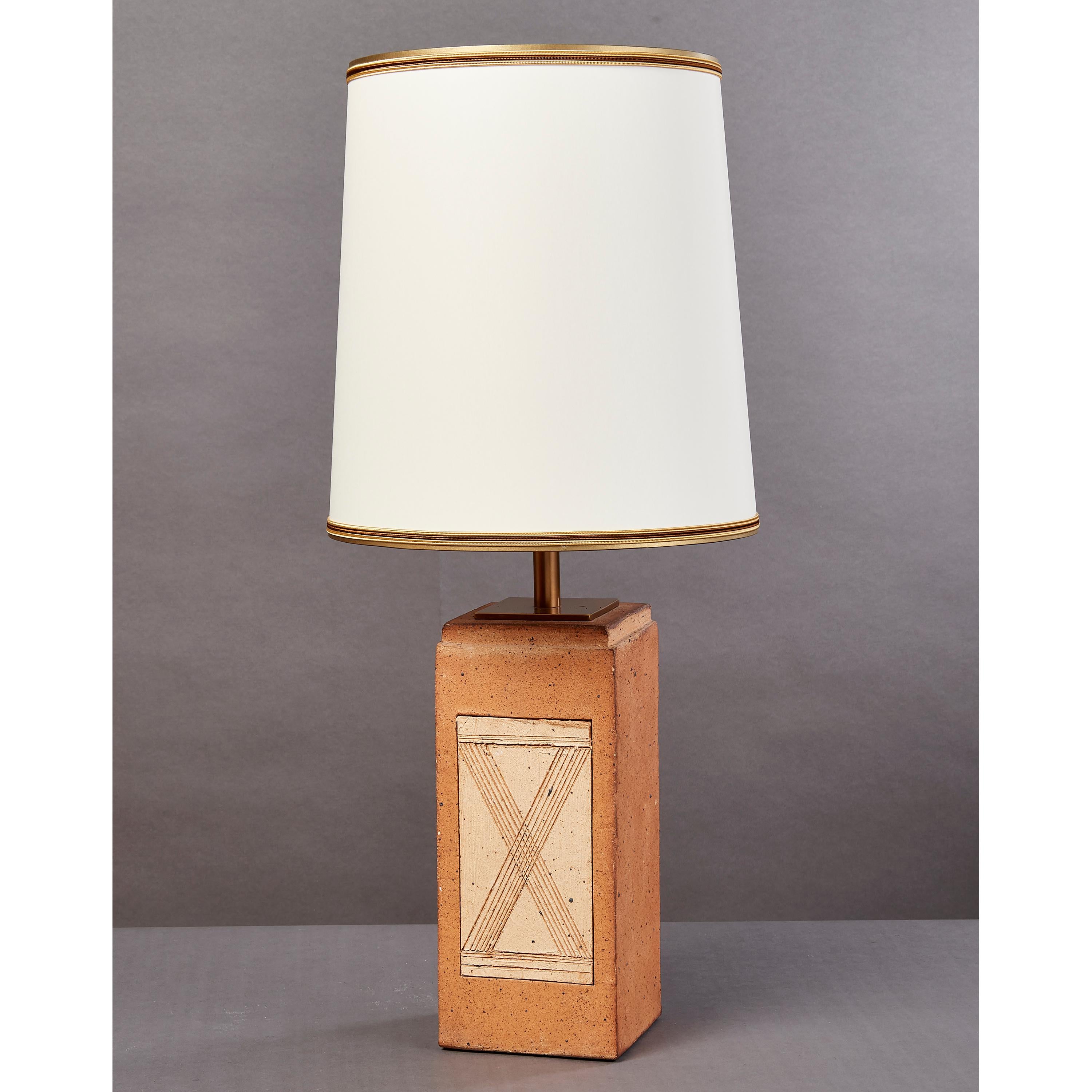 France, 1970s
Geometric fired ceramic lamp with incised abstract geometric motifs
Rewired for use in the US with one standard base bulb
One of a collection of French, 1970s fired ceramic lamps, see last two images for two oval shaped