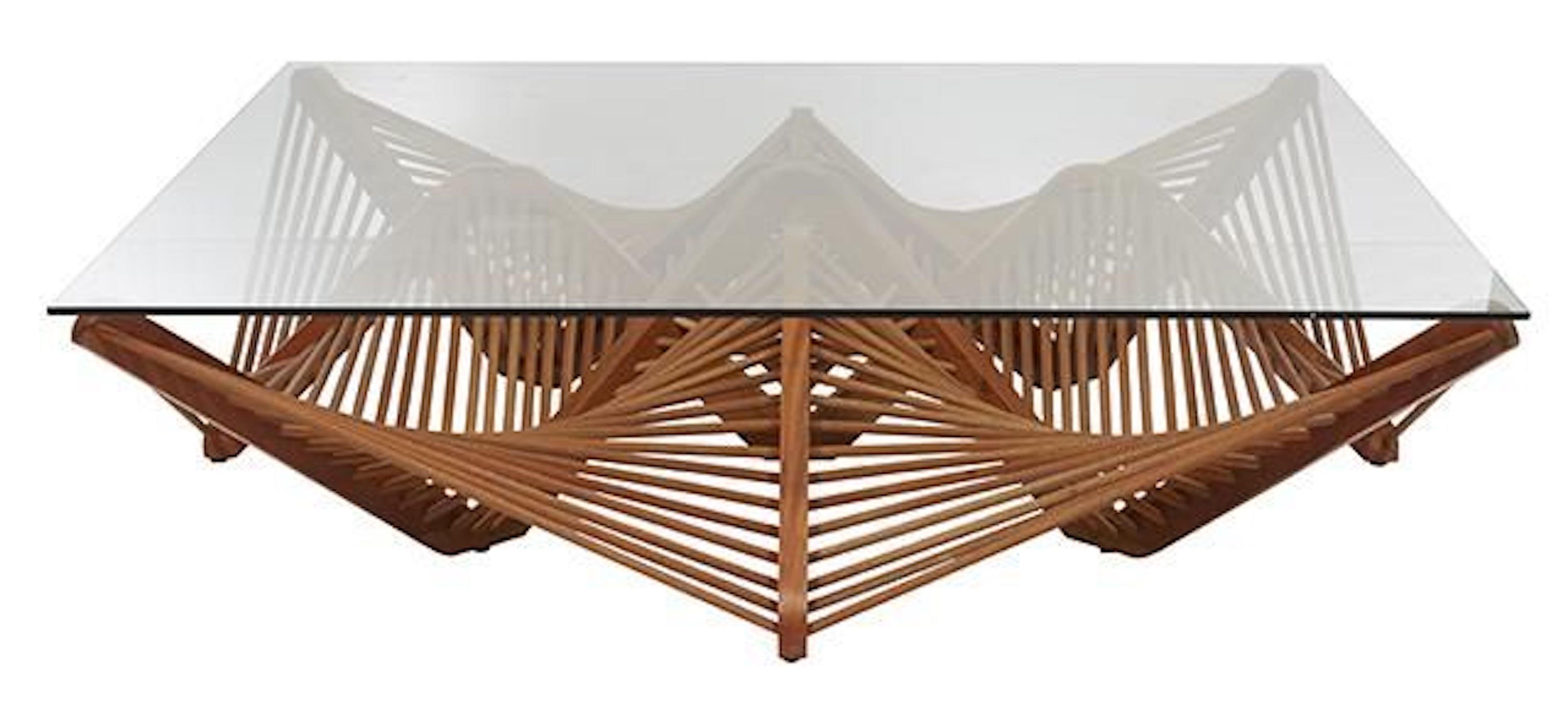 This innovative design, conceived by Vito Selma, showcases a captivating arrangement of geometric shapes crafted with lauan wood. The bold web of interconnected shapes adds an element of intrigue to the overall design. With its unique construction,