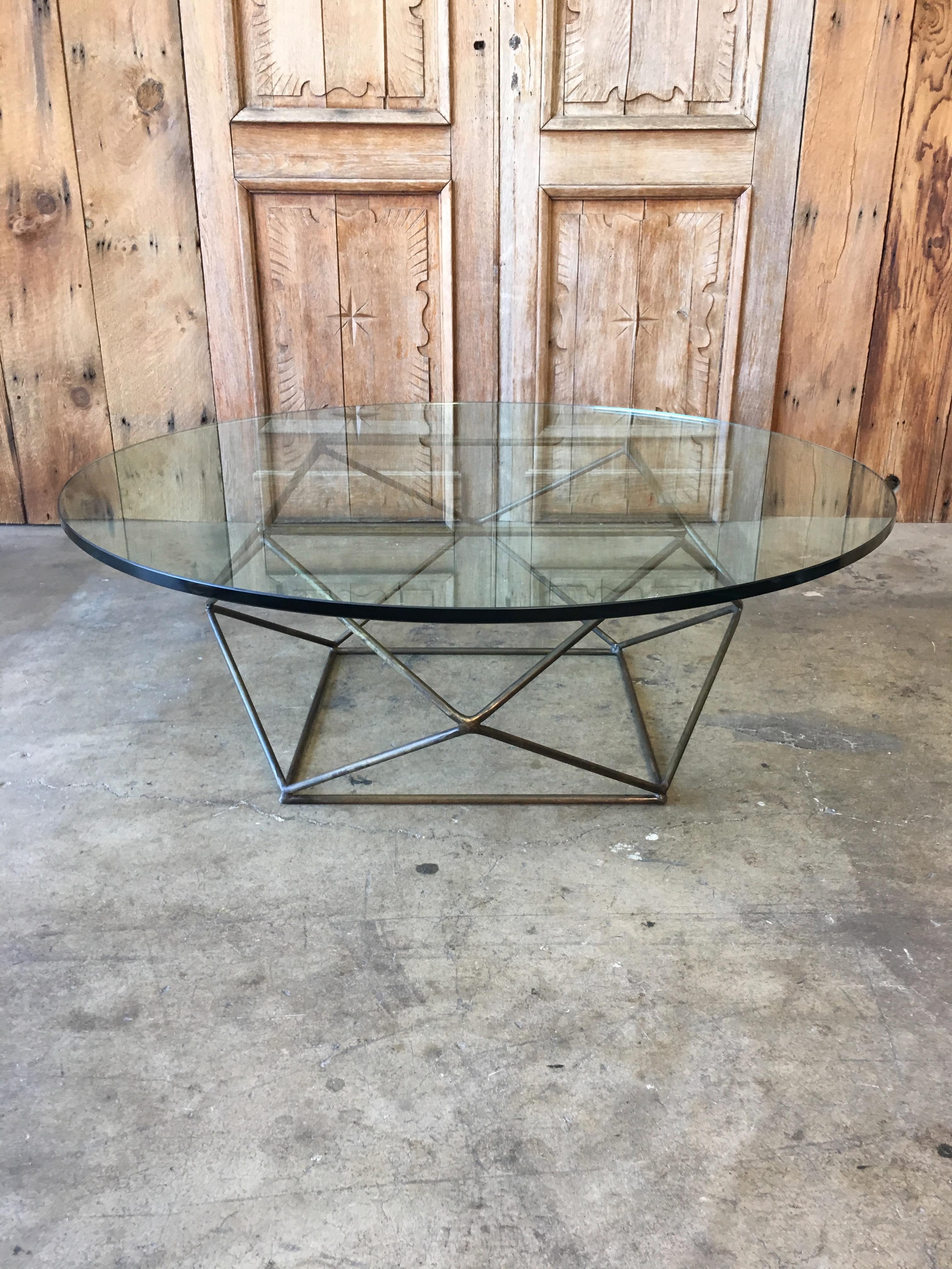 Beautiful 1970s Geometric Bronze finish base with glass. Measures: Glass top is 47.5