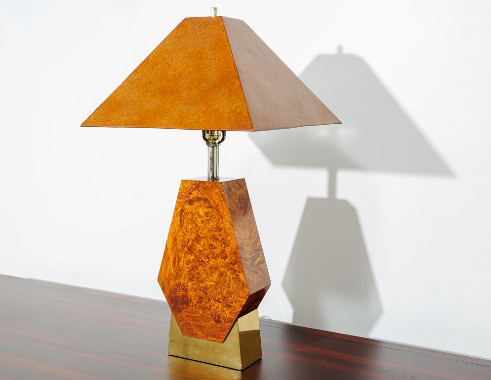 Table lamp with brass and faux-burl wood base topped with a 4-sided cork shade.