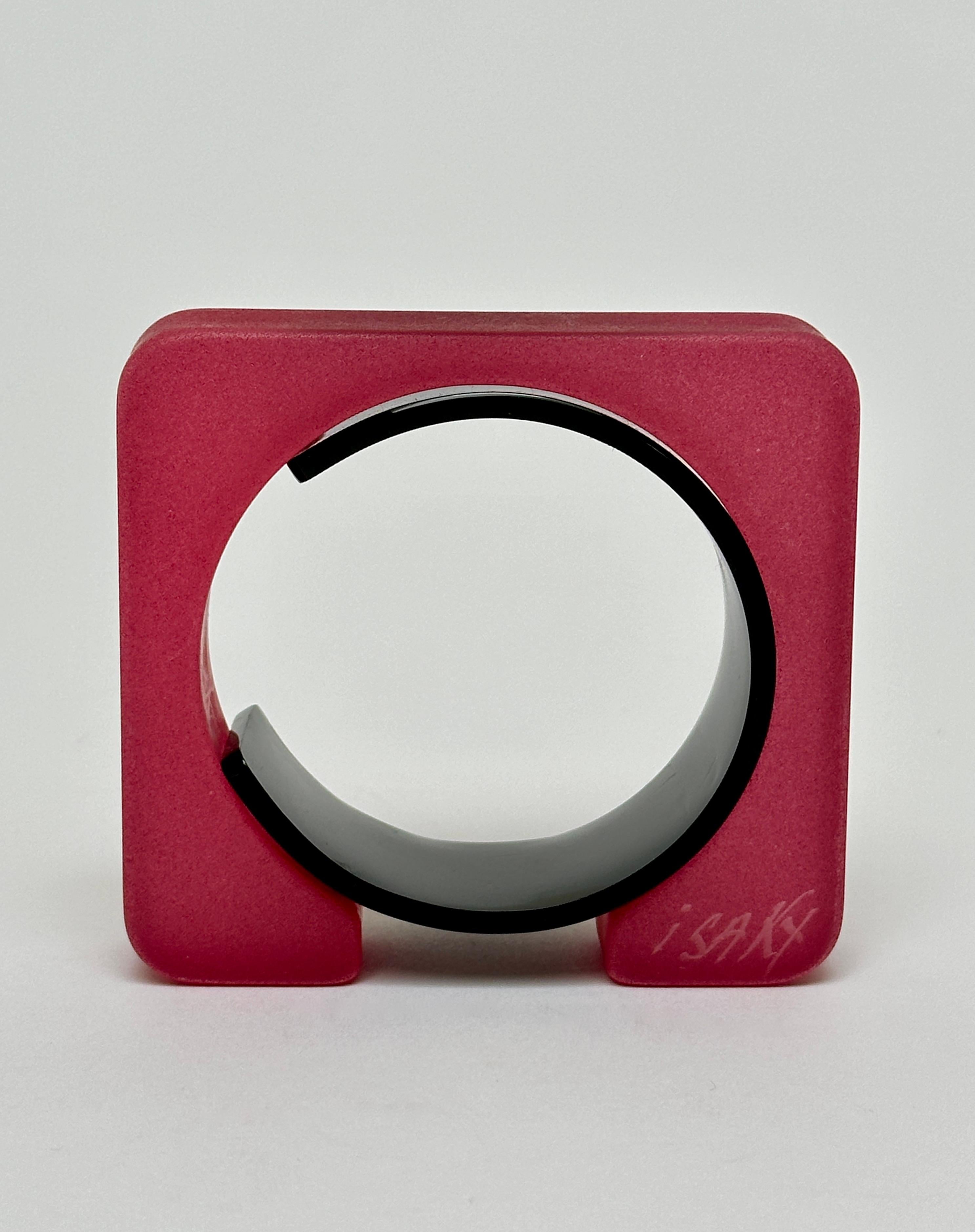 Half object, half jewel this sculptural bangle is composed of two parts ; a sand blasted resin rectangle and an acrylic bracelet allowing the cuff to be closed.
The bangle bears the handwritten and engraved signature of the artist.

Measurements