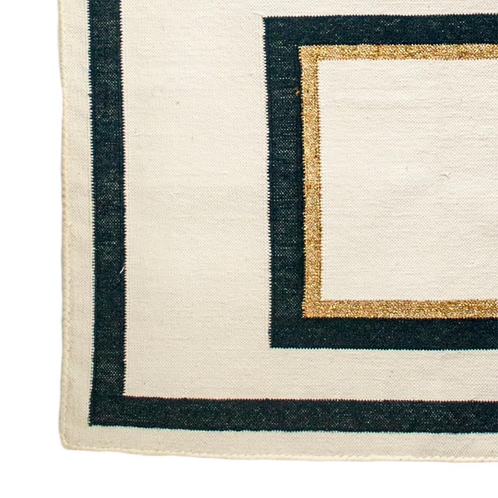 This geometric area rug has been ethically hand woven in the finest cotton yarns by artisans in Rajasthan, India, using a traditional weaving technique which is native to this region.

The purchase of this handcrafted rug helps to support the