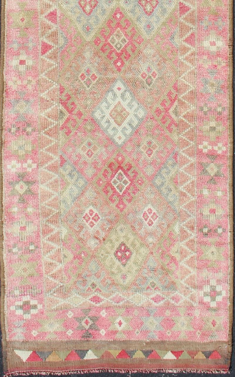 Unique Runner in Light Green, pink red colored Turkish runner in Kurdish design, rug en-165332, country of origin / type: Turkey / Turkish.

This runner from Turkey features an all over diamond design, commonly used in Kurdish bag faces of mid 19th