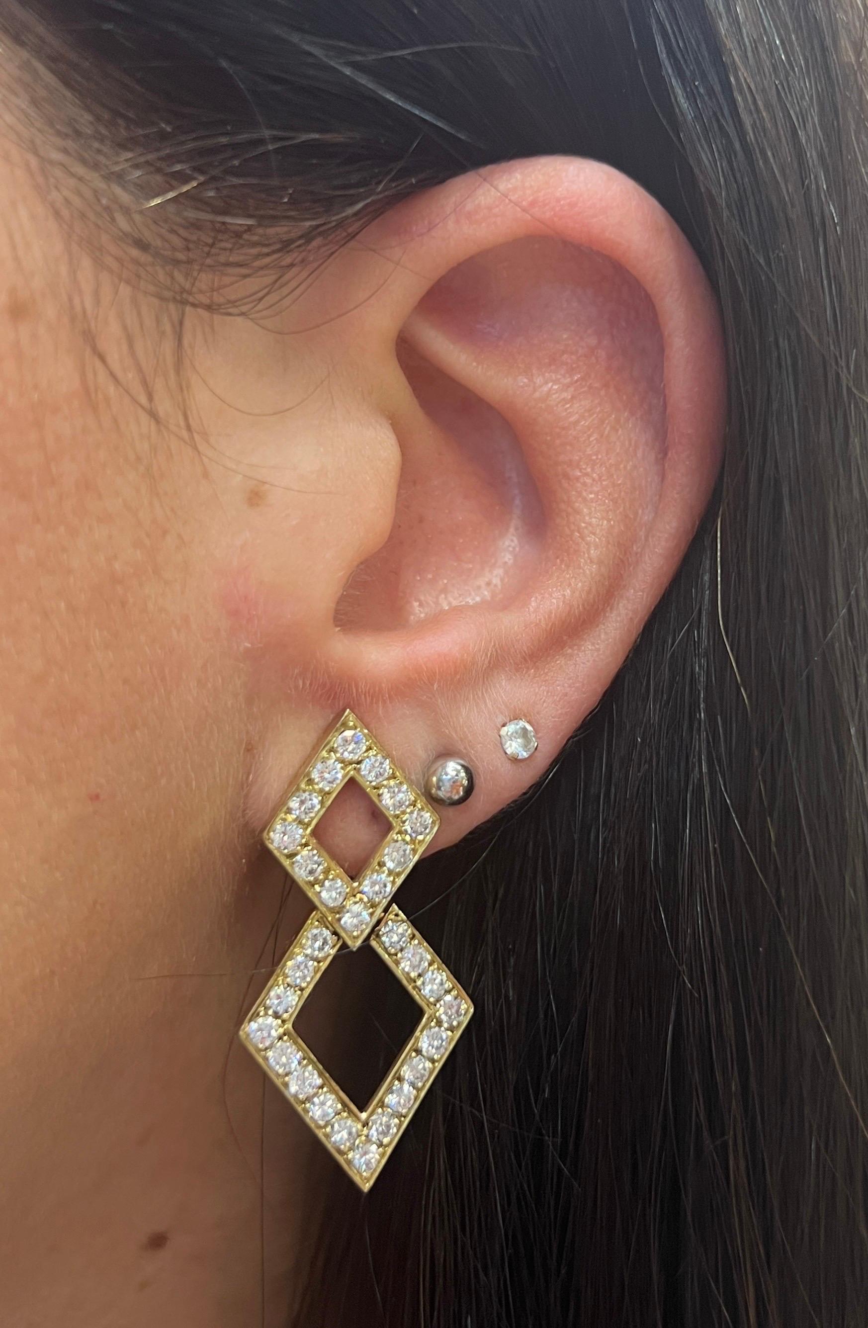 Geometric Diamond Earrings

Round Diamond Weight: approximately 2.61 carats 

Measurements: 1.25