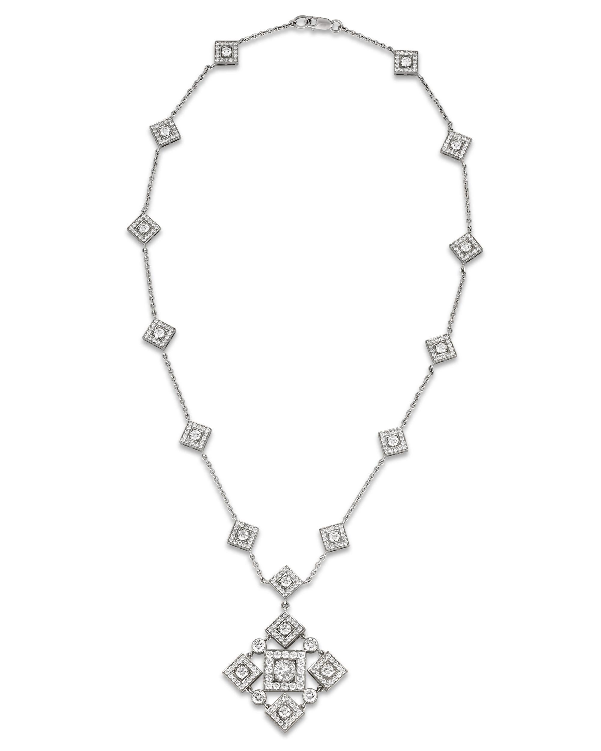 Dazzling white diamonds totaling 6.43 carats displaying coveted D-F color and VS clarity are arranged in a stunning geometric pattern in this pendant necklace. Set in platinum.

Pendant: 2