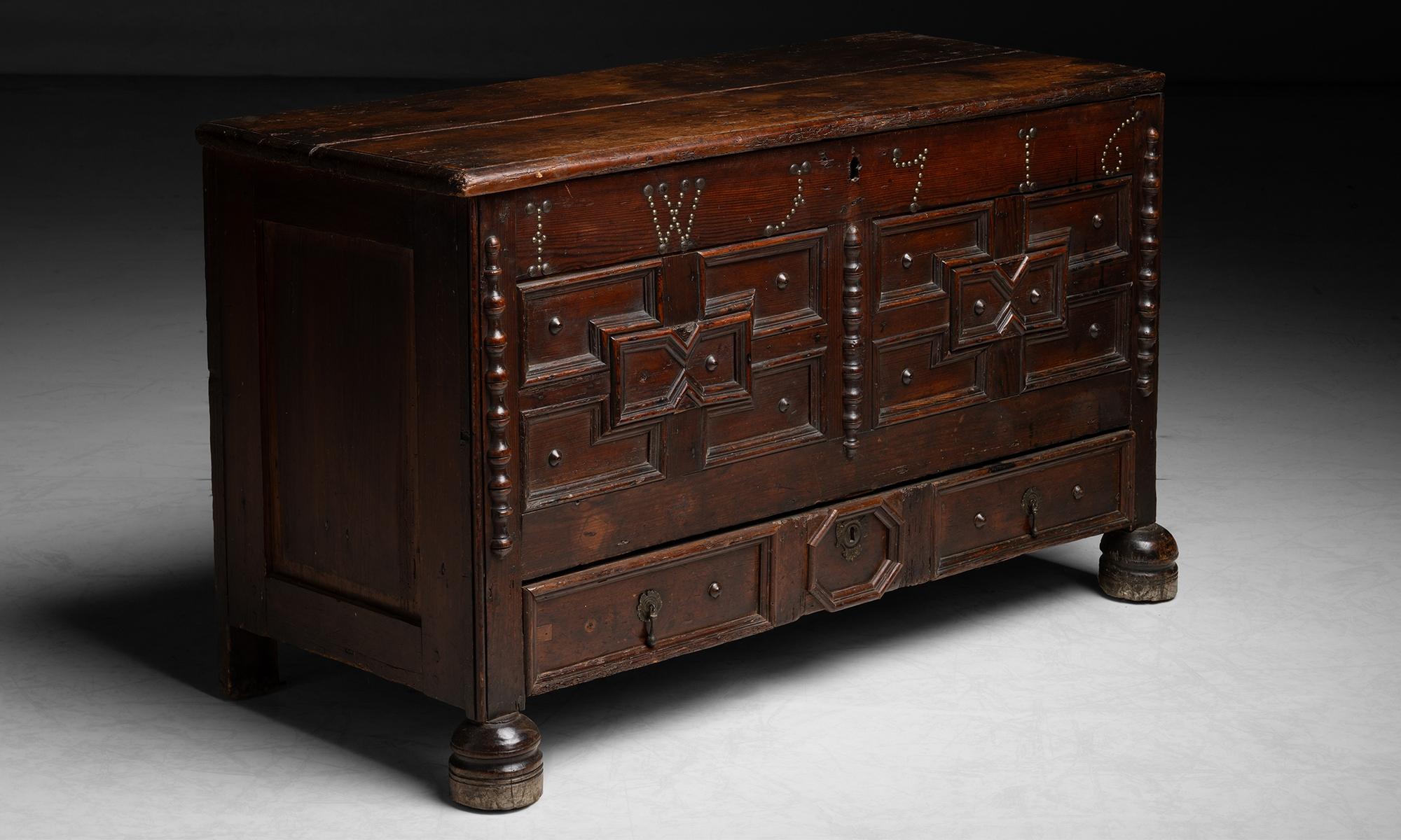Geometric Dowery Chest, England 1716

Constructed in pine, chest with single drawer on bottom, original stain and brass studding.

45”L x 20”d x 27”h

Ref. CFRN1197