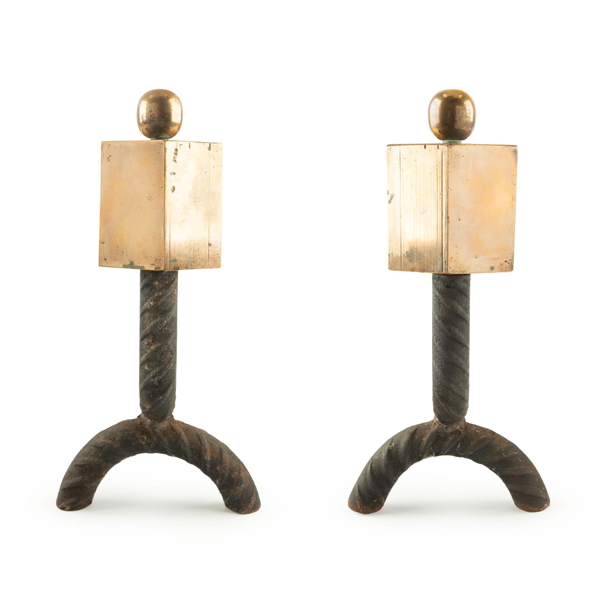 Pair of Mid-Century Modern Bronze and Iron Andirons, France
A striking pair of Mid-Century Modern andirons crafted in France, featuring bold geometric design with square bronze blocks capped by polished bronze spheres, supported on twisted iron