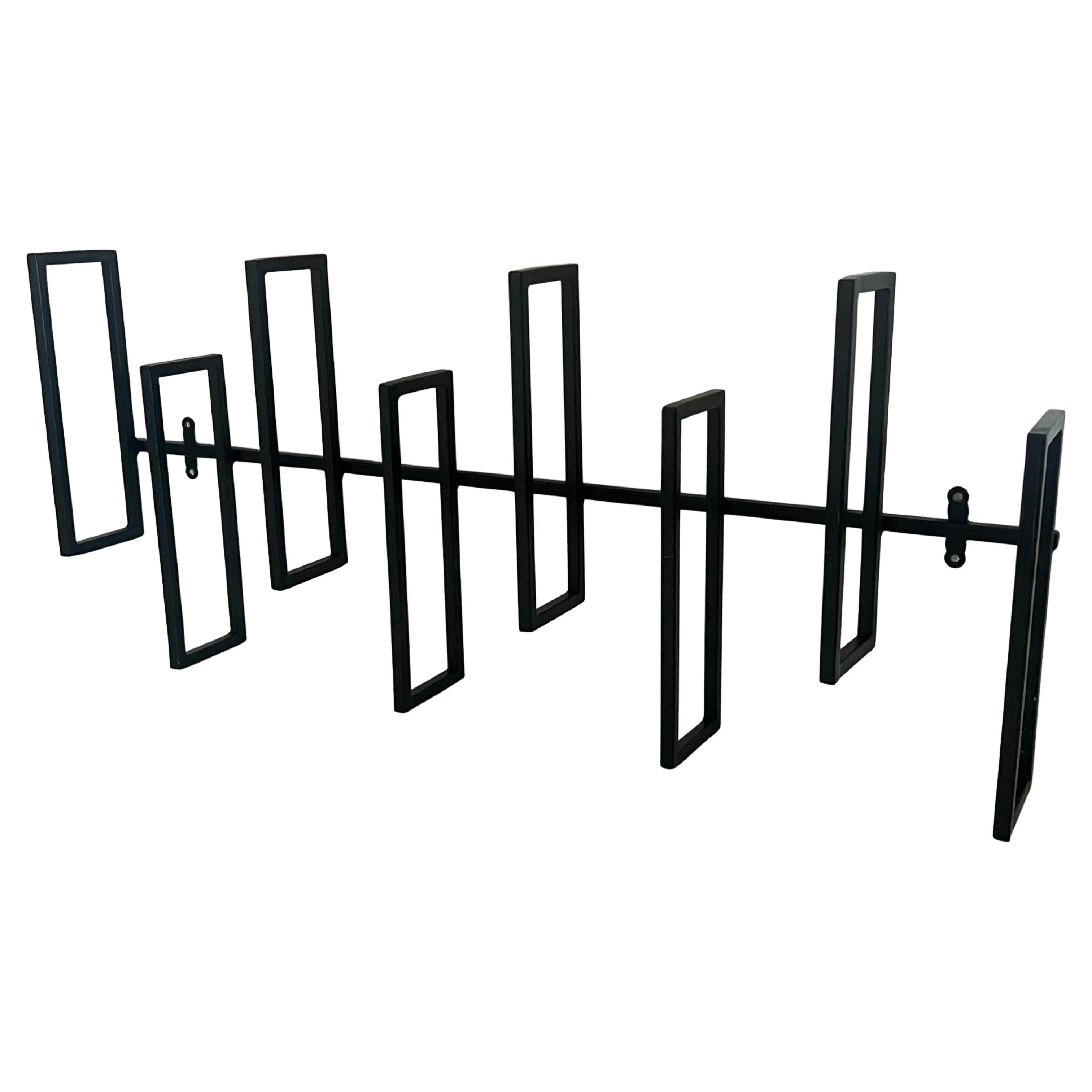 Black enameled iron indoor / outdoor wall relief sculpture, circa 1980's easy to mount cool design that blends well with mid Century contemporary Boho home decor.